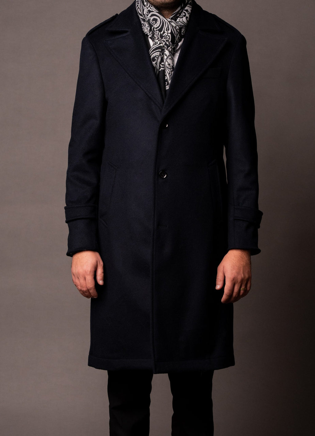 Navy men's luxury coat from Quiet Luxury, stylish and tailored, displayed on a hanger with a neutral background.