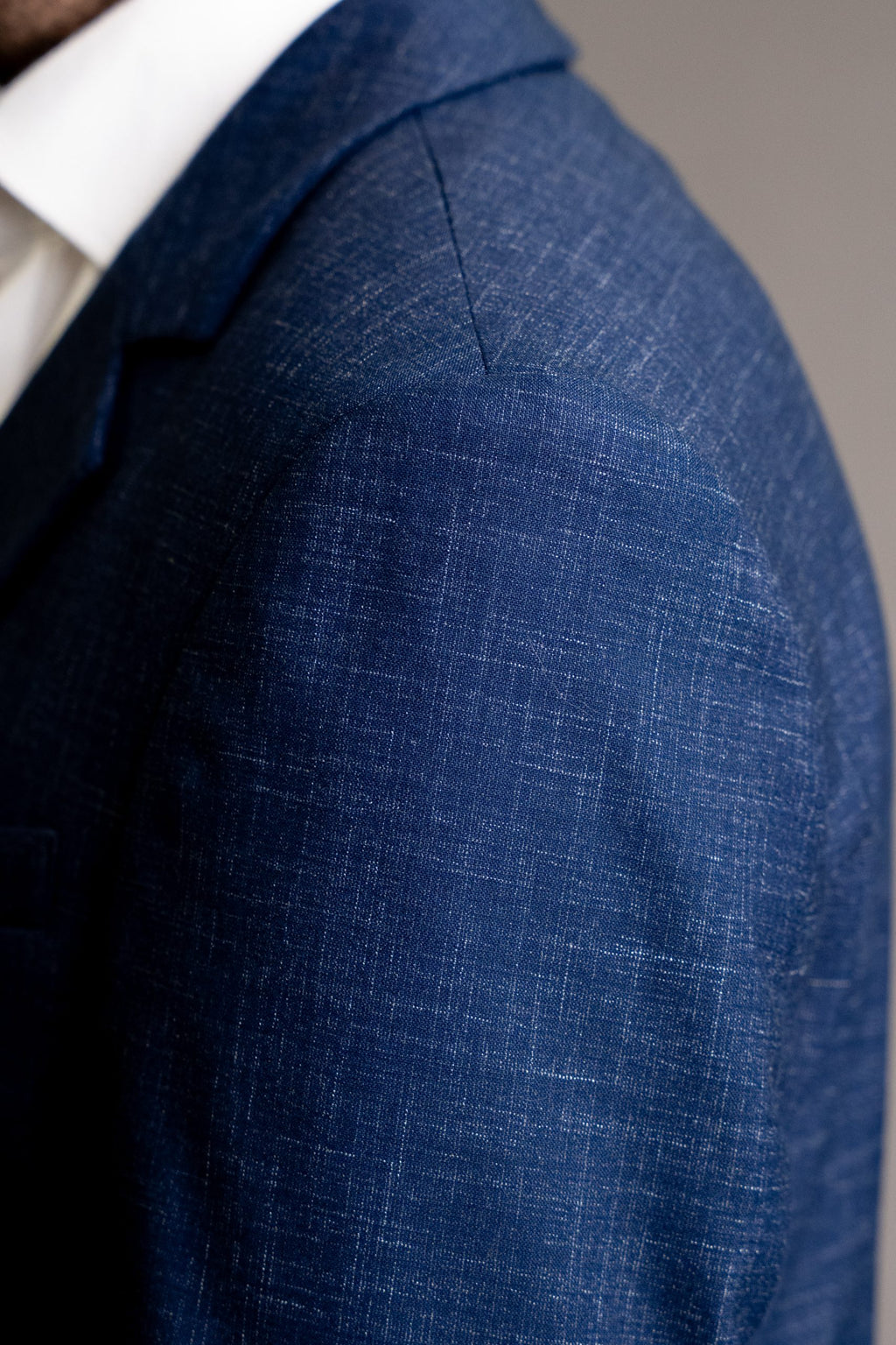 Blue textured blazer from CoutureforGentlemen, stylish men's suit jacket with refined fabric details and tailored fit.