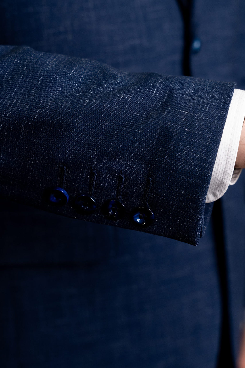 Blue textured suit jacket with subtle patterns from Couture for Gentlemen, style CFGS202, shown on a hanger.