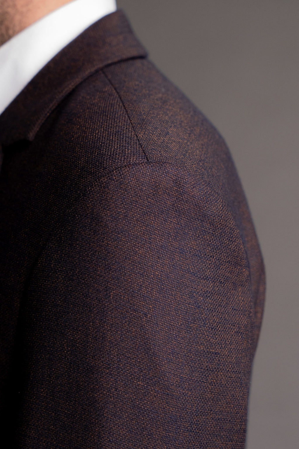 Chocolate brown men's suit jacket from Couture for Gentlemen, tailored fit with lapel collar and stylish design.
