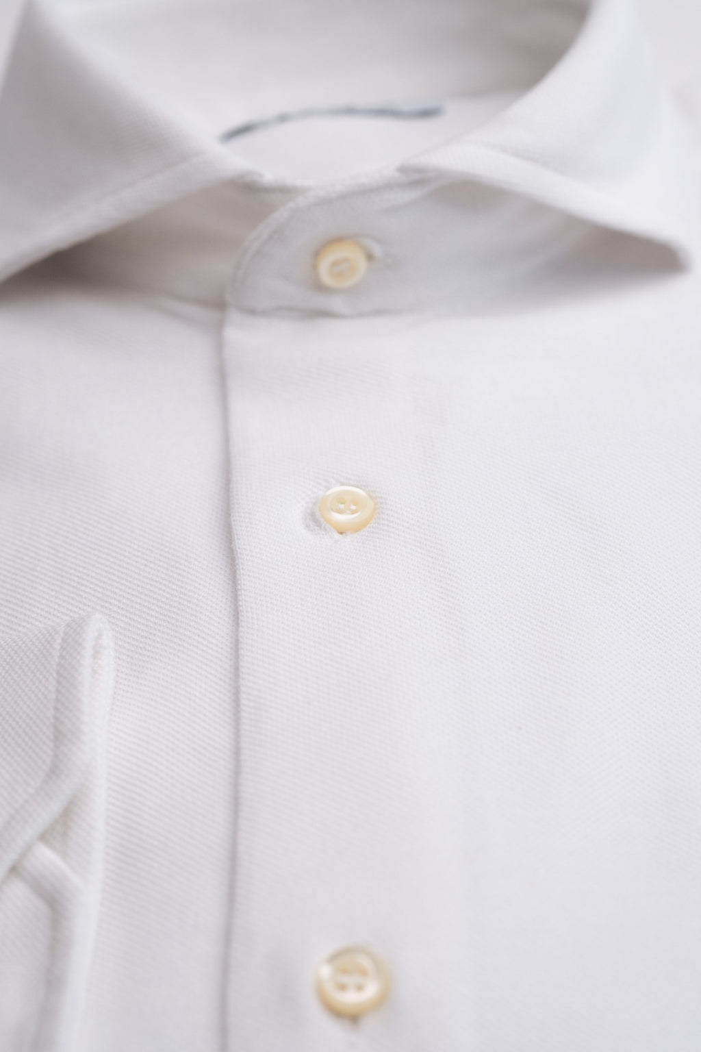 White men's shirt from Sthenford CMS02AS collection, shown on a hanger with detailed collar and crisp fabric.