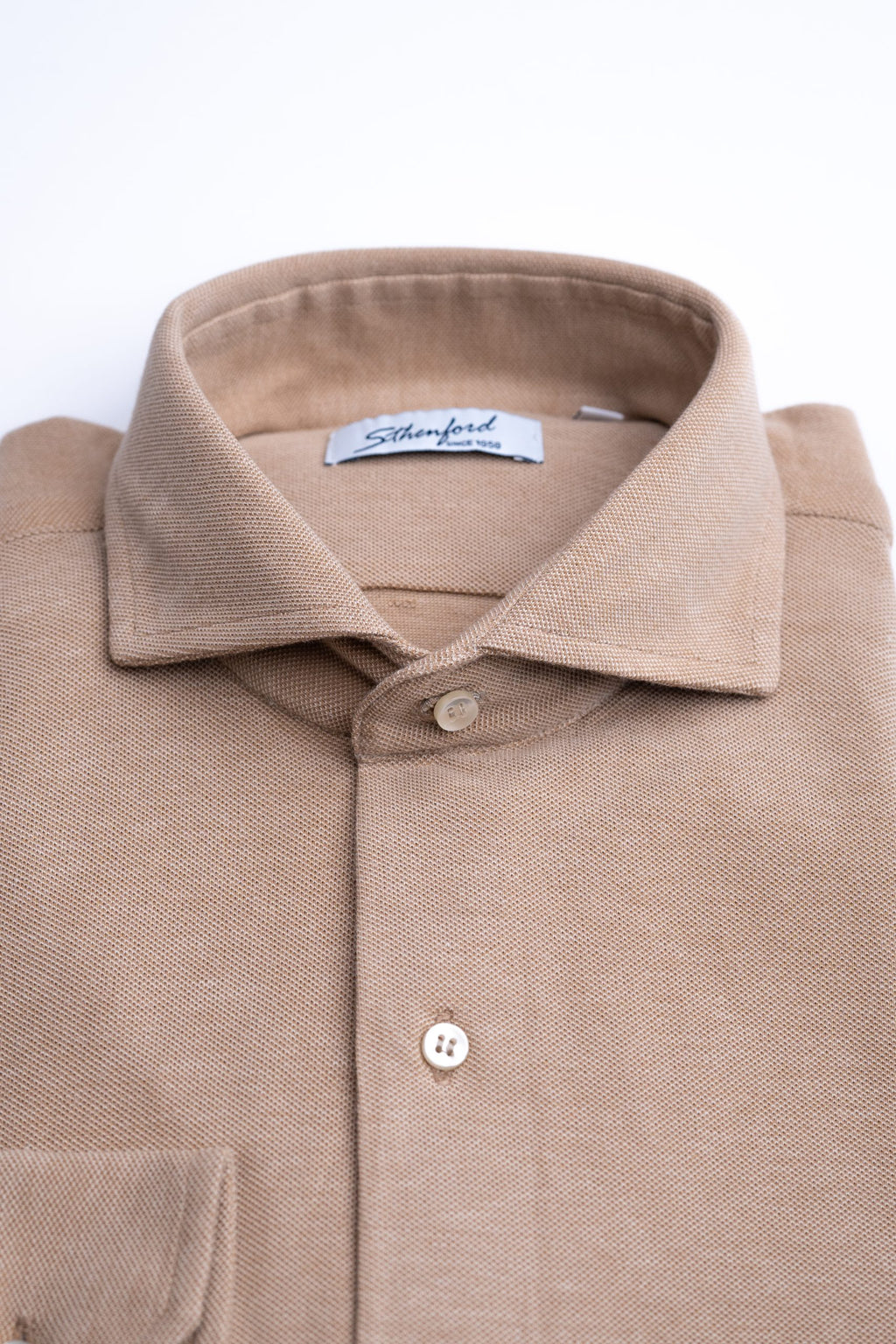 Beige men's shirt from Sthenford CMS02BJS collection, stylish men's fashion shirt with collar and button-down front.