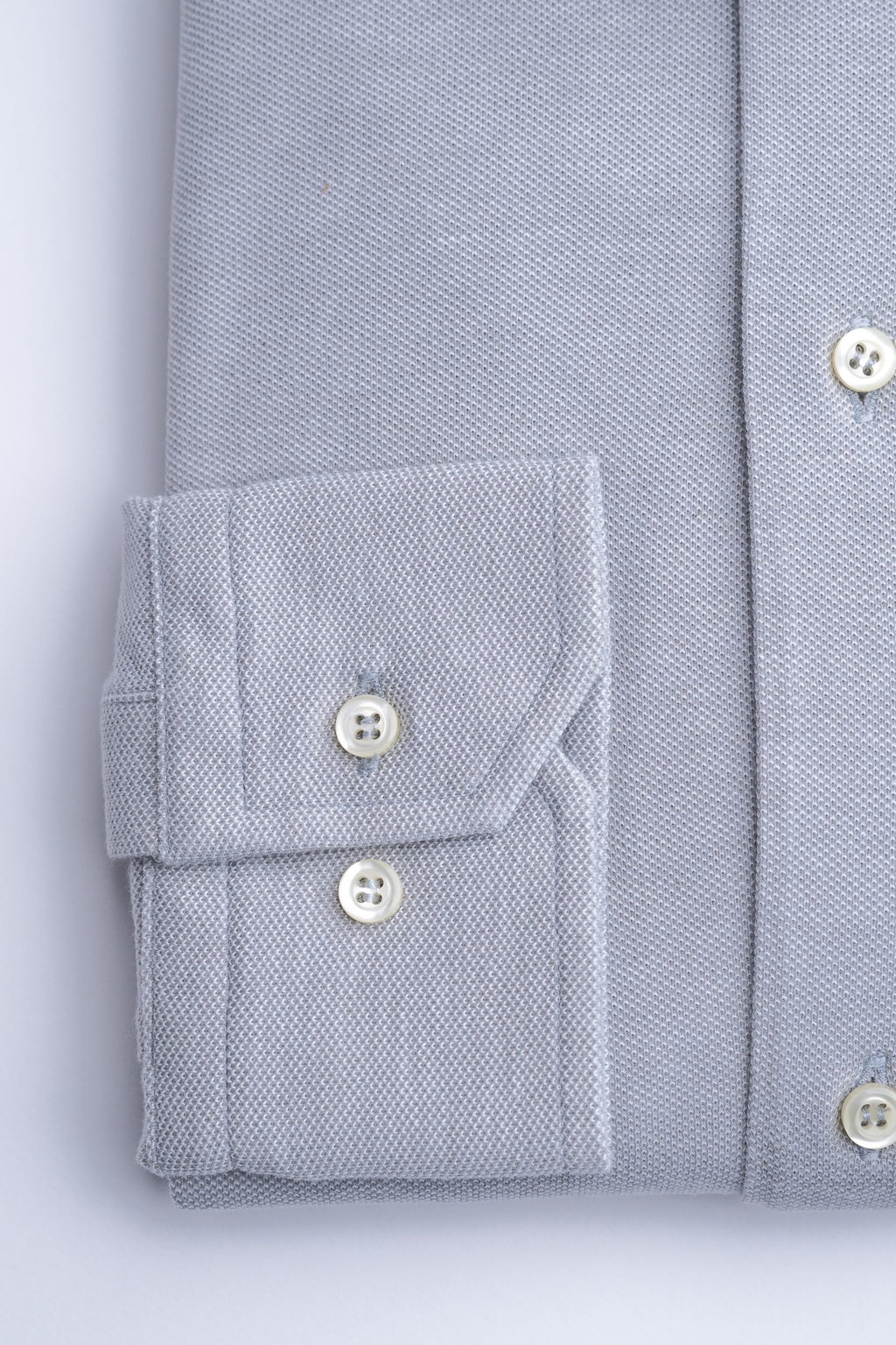 Light gray men's shirt by Sthenford, featuring a classic fit and button-down design, displayed on a hanger.