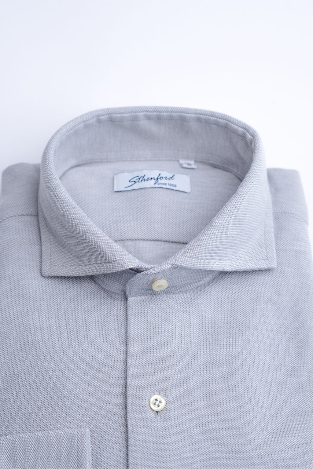 Light gray men's shirt from Sthenford Cms02gds collection, featuring a classic fit and button-down collar, displayed on a hanger.