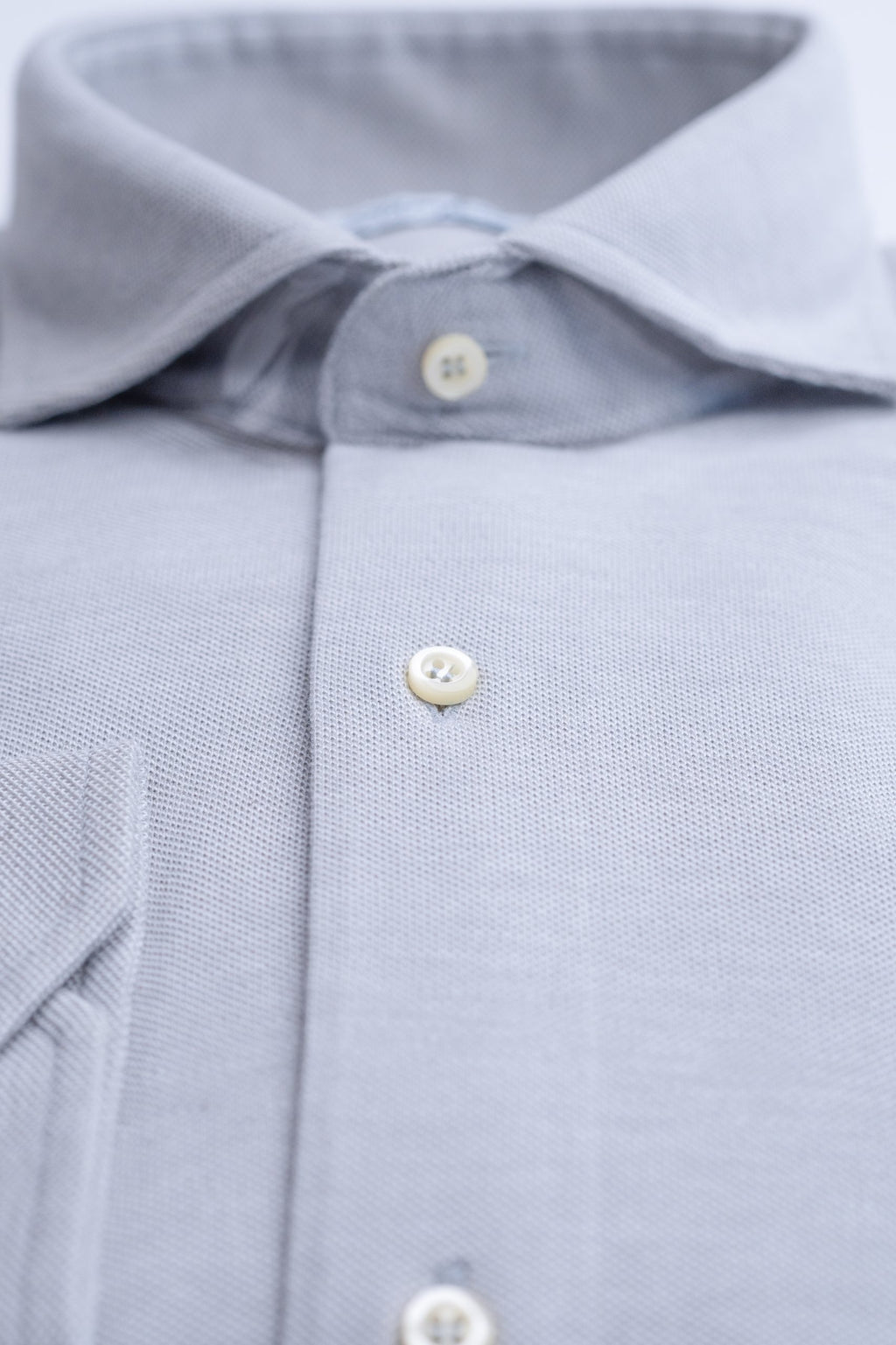 Light gray men's dress shirt by Sthenford, featuring a classic fit and button-down collar, shown on a hanger.