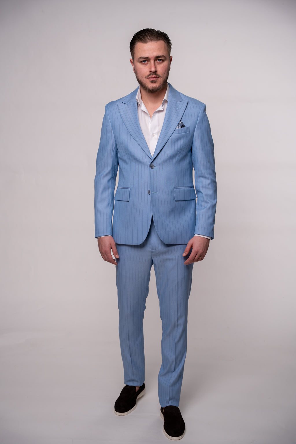 Light blue men's striped costume suit, stylish formal attire with vertical stripes, designed by CoutureforGentlemen.