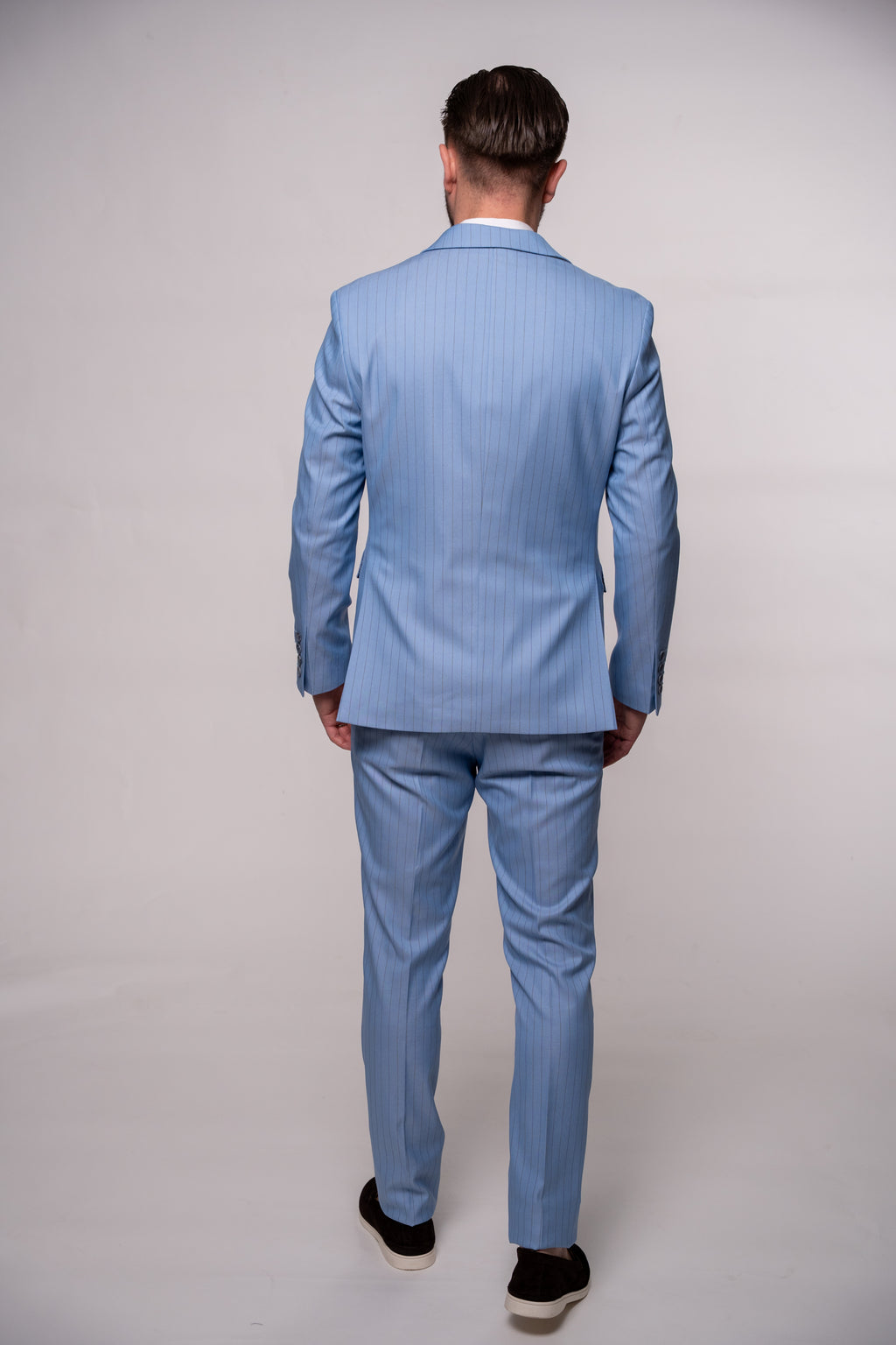 Light blue men's striped costume jacket with notch lapel, tailored fit, and stylish design.