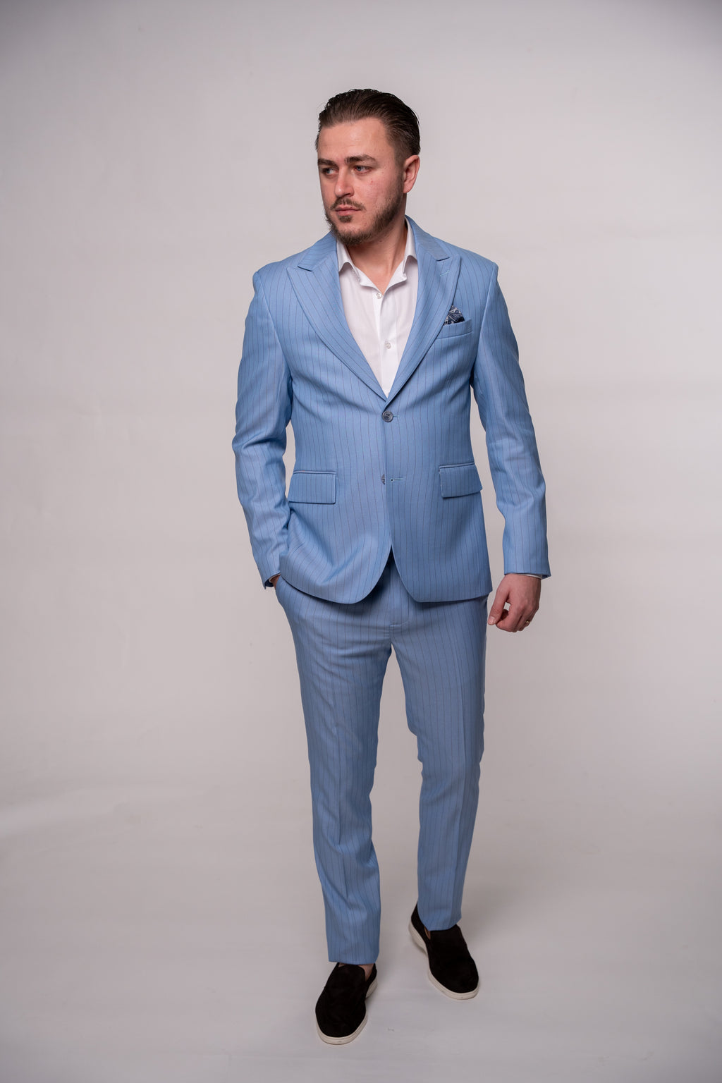 Light blue men's striped costume jacket from CoutureforGentlemen, tailored fit with classic lapel and button closure.
