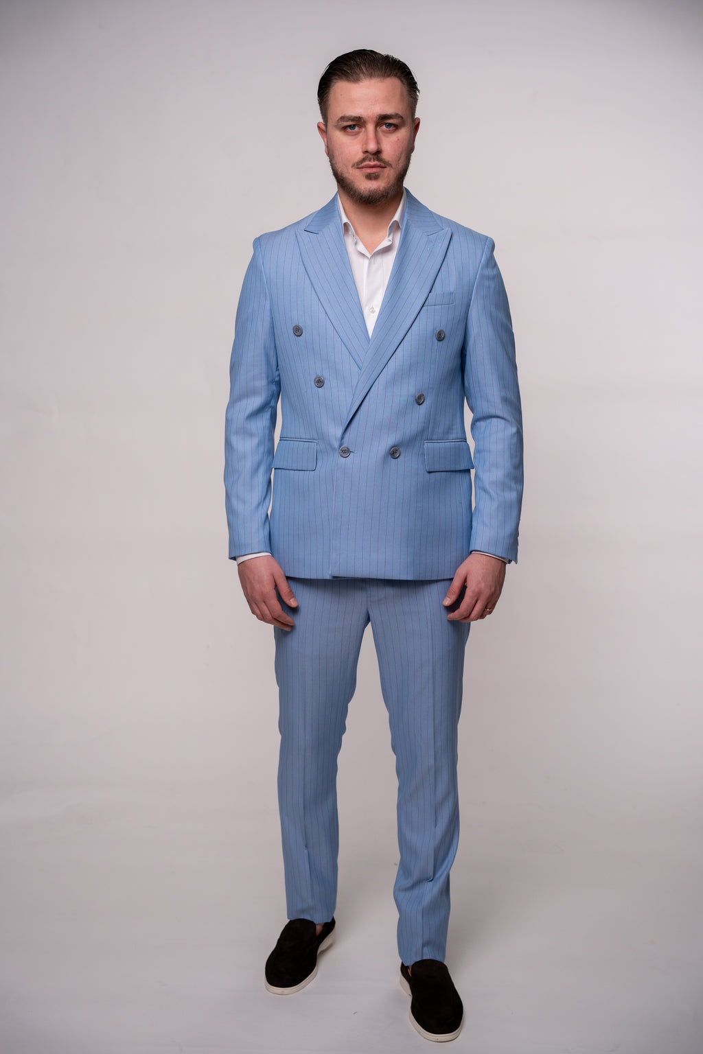 Light blue striped two-row button costume from Coutureforgentlemen, featuring classic style and tailored fit.