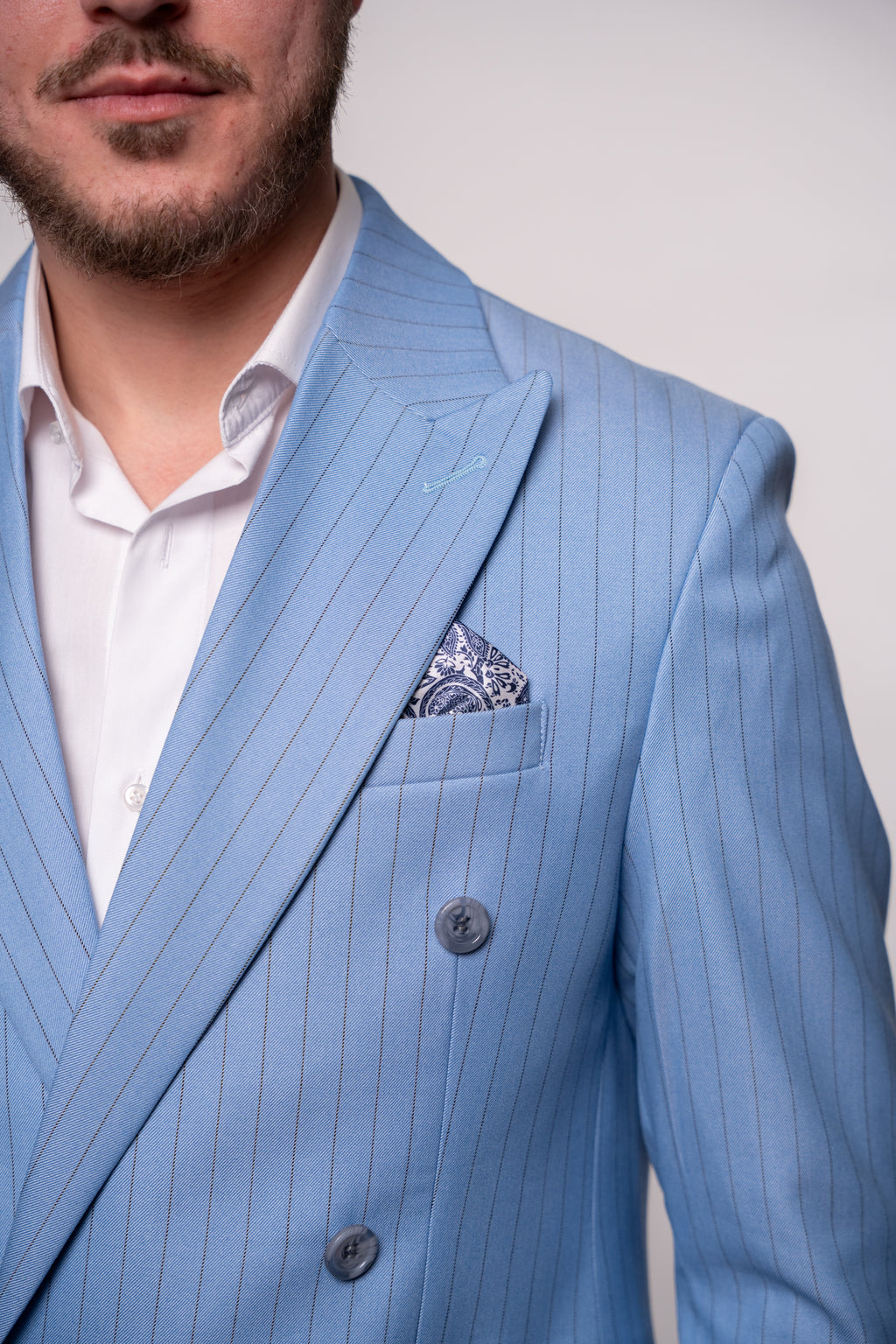 Light blue striped double-breasted costume jacket with two rows of buttons, stylish and tailored by CoutureforGentlemen.