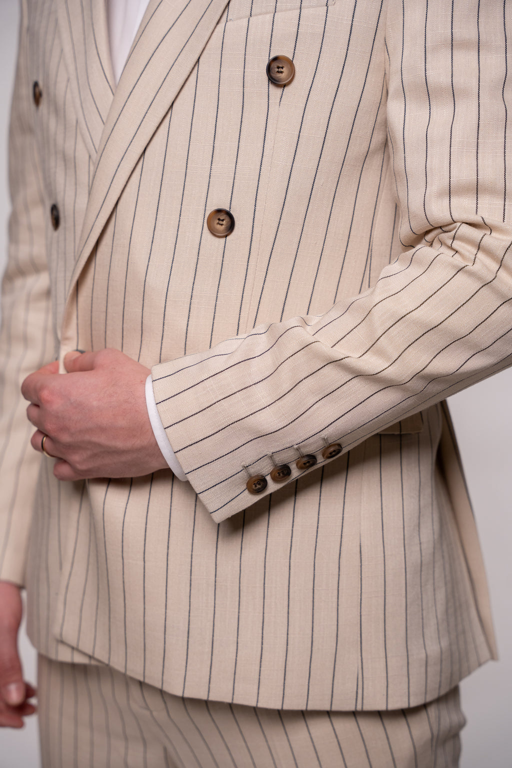 Beige men's linen blazer with double row of buttons, stylish striped pattern, tailored fit, from Couture for Gentlemen.