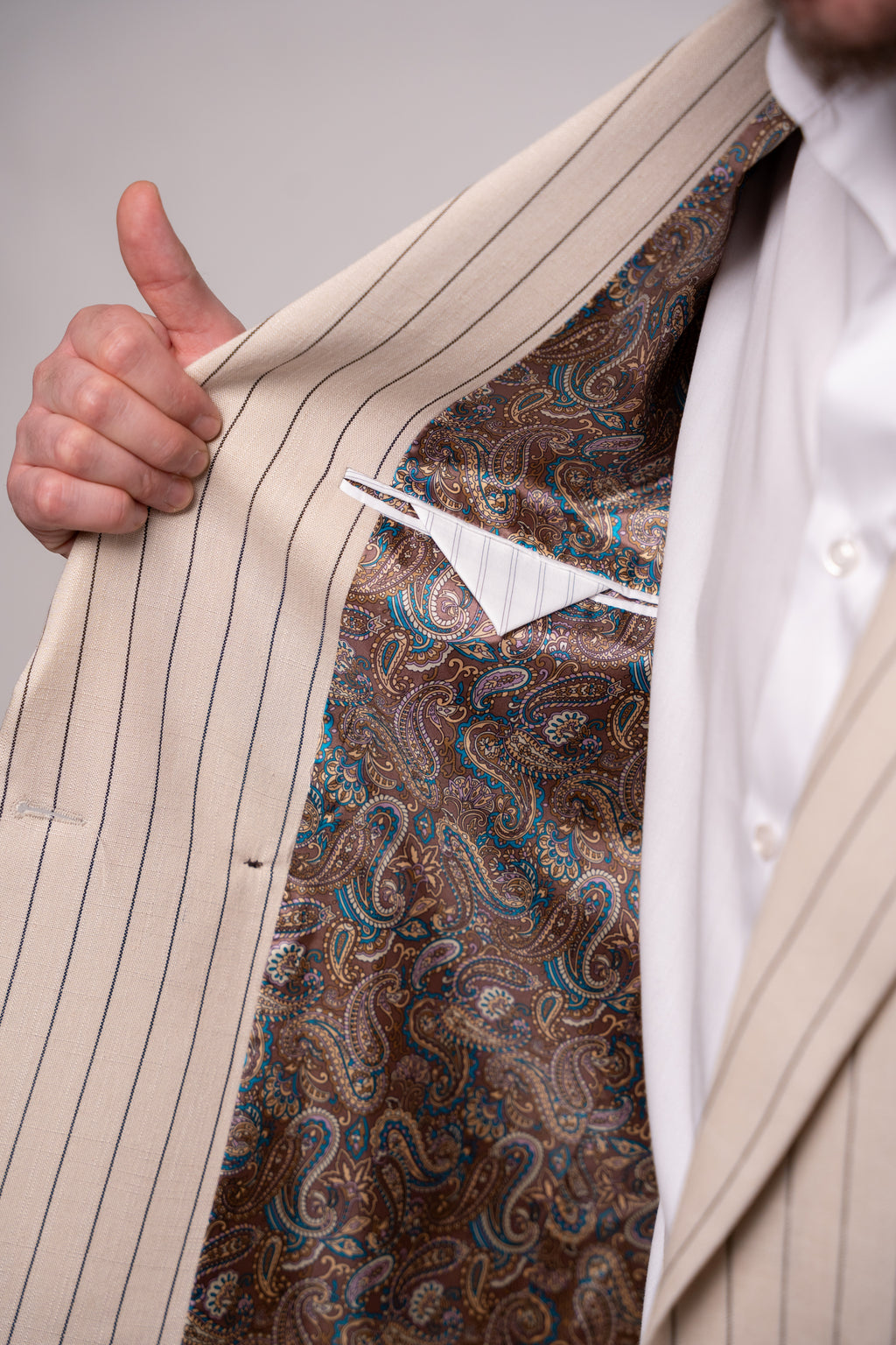 Beige men's linen blazer with two rows of buttons, featuring a striped pattern, from CoutureforGentlemen.