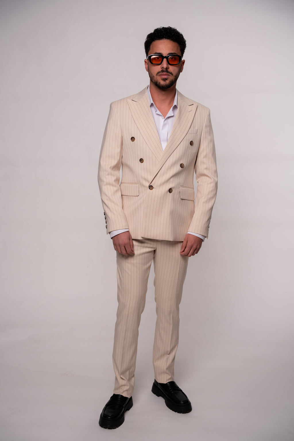 Beige men's blazer with two rows of buttons and striped pattern, stylish formal jacket by Couture for Gentlemen.