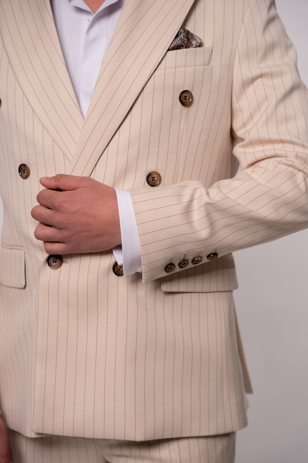 Beige men's blazer with double-row buttons and stripe pattern, tailored by Couture for Gentlemen, stylish formal suit jacket.