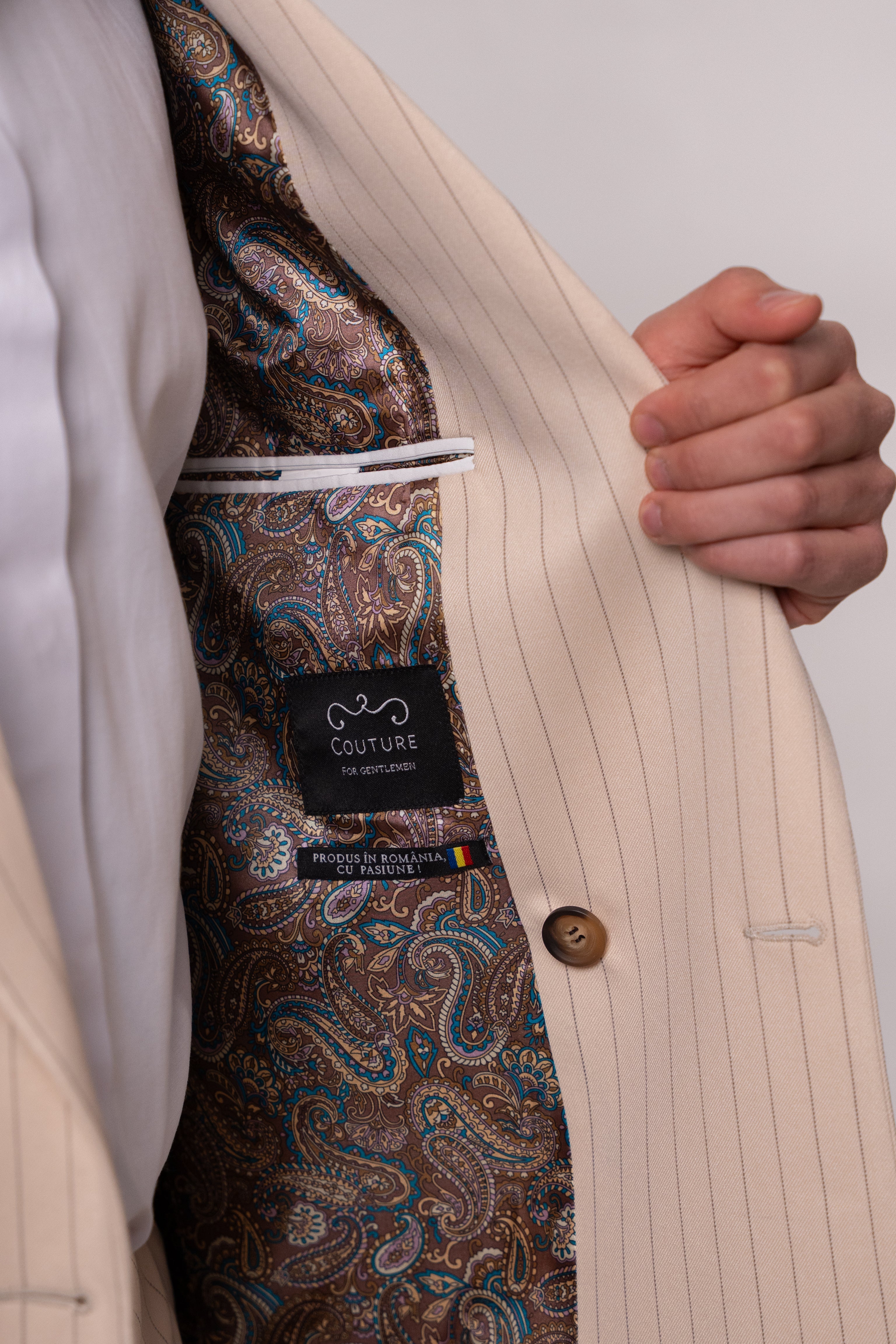 Beige men's double-breasted suit with striped pattern, featuring two rows of buttons, from CoutureforGentlemen.ro.