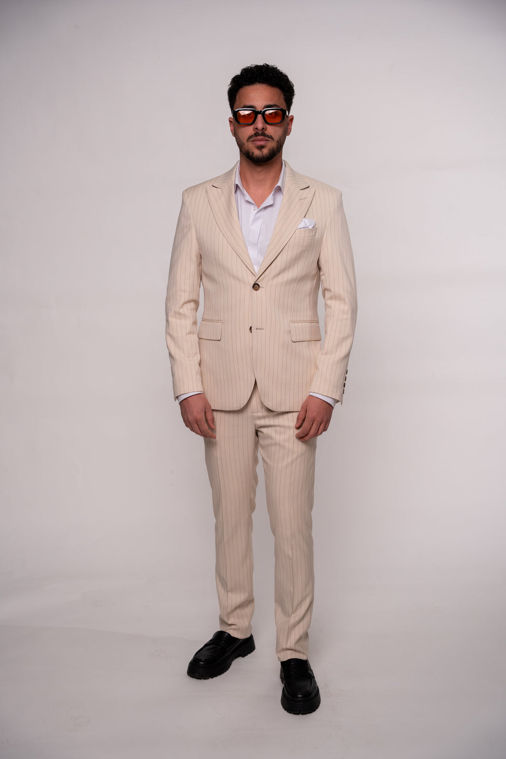 Beige men's striped suit jacket by CoutureforGentlemen, tailored fit with classic pattern and stylish lapel detail.