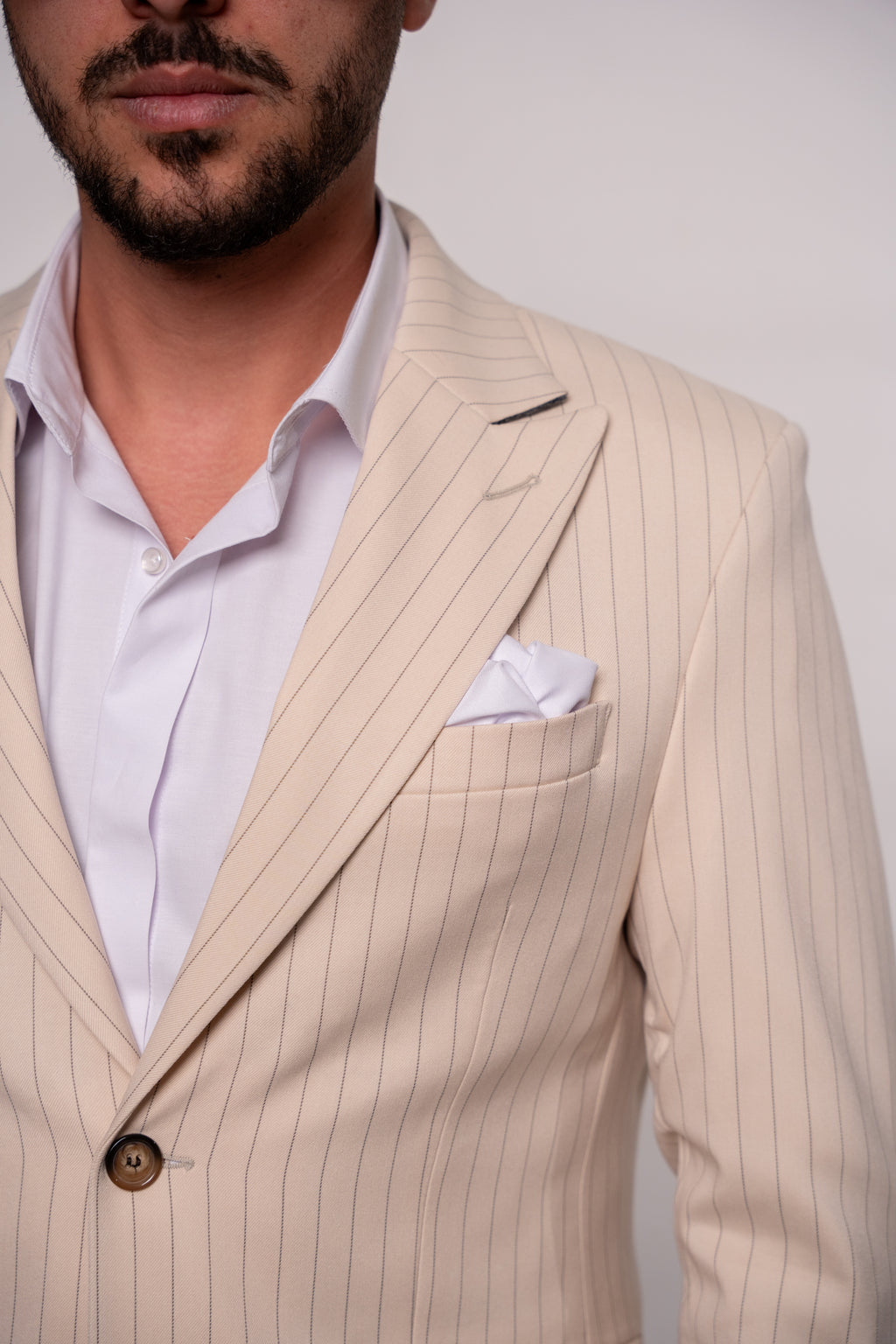 Beige men's striped suit jacket, tailored fit, featuring classic dungi pattern, from Couture for Gentlemen.