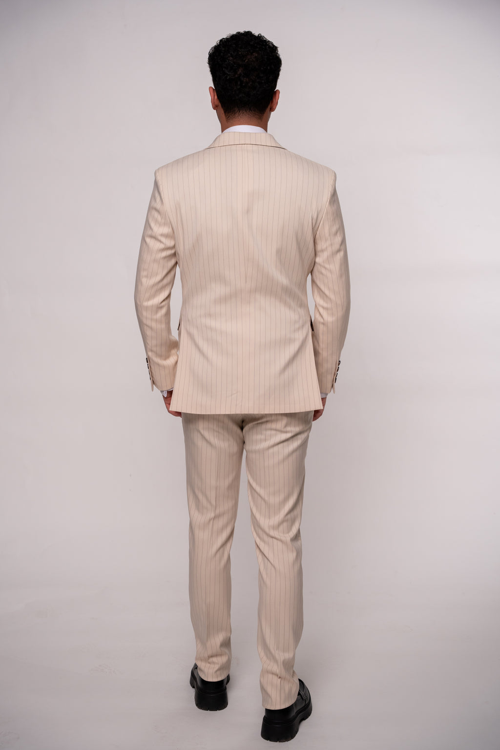 Beige men's striped costume blazer from CoutureforGentlemen, tailored fit with classic pattern, shown on a hanger.