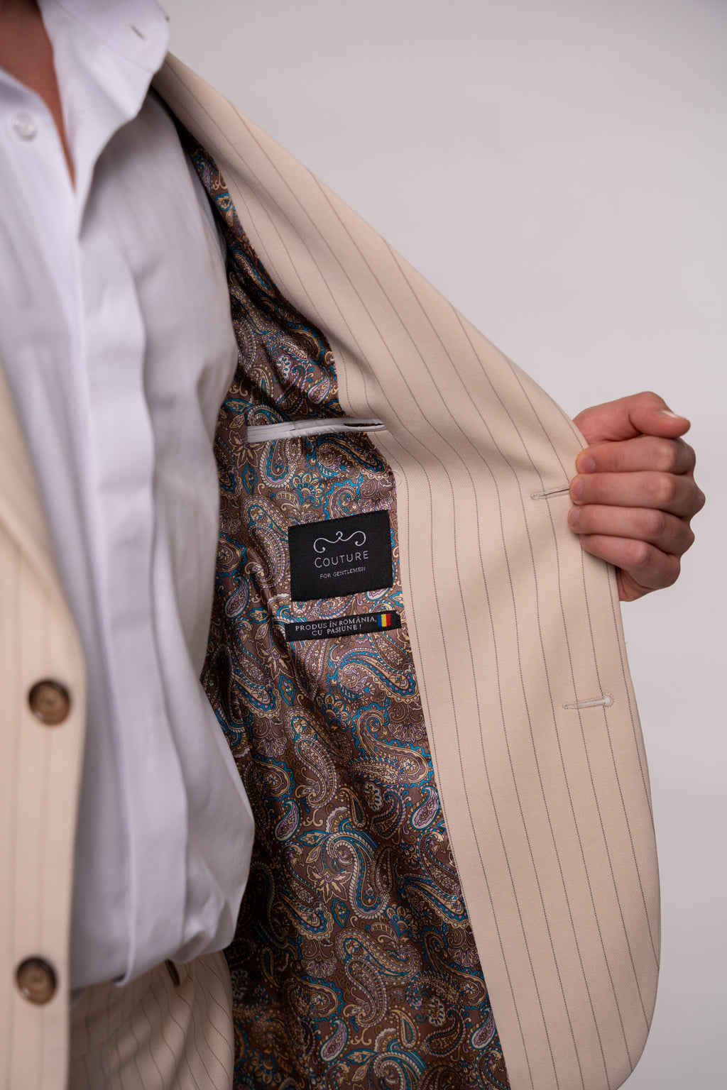 Beige men's striped suit jacket by CoutureforGentlemen, featuring classic pattern and tailored fit, shown on a mannequin.