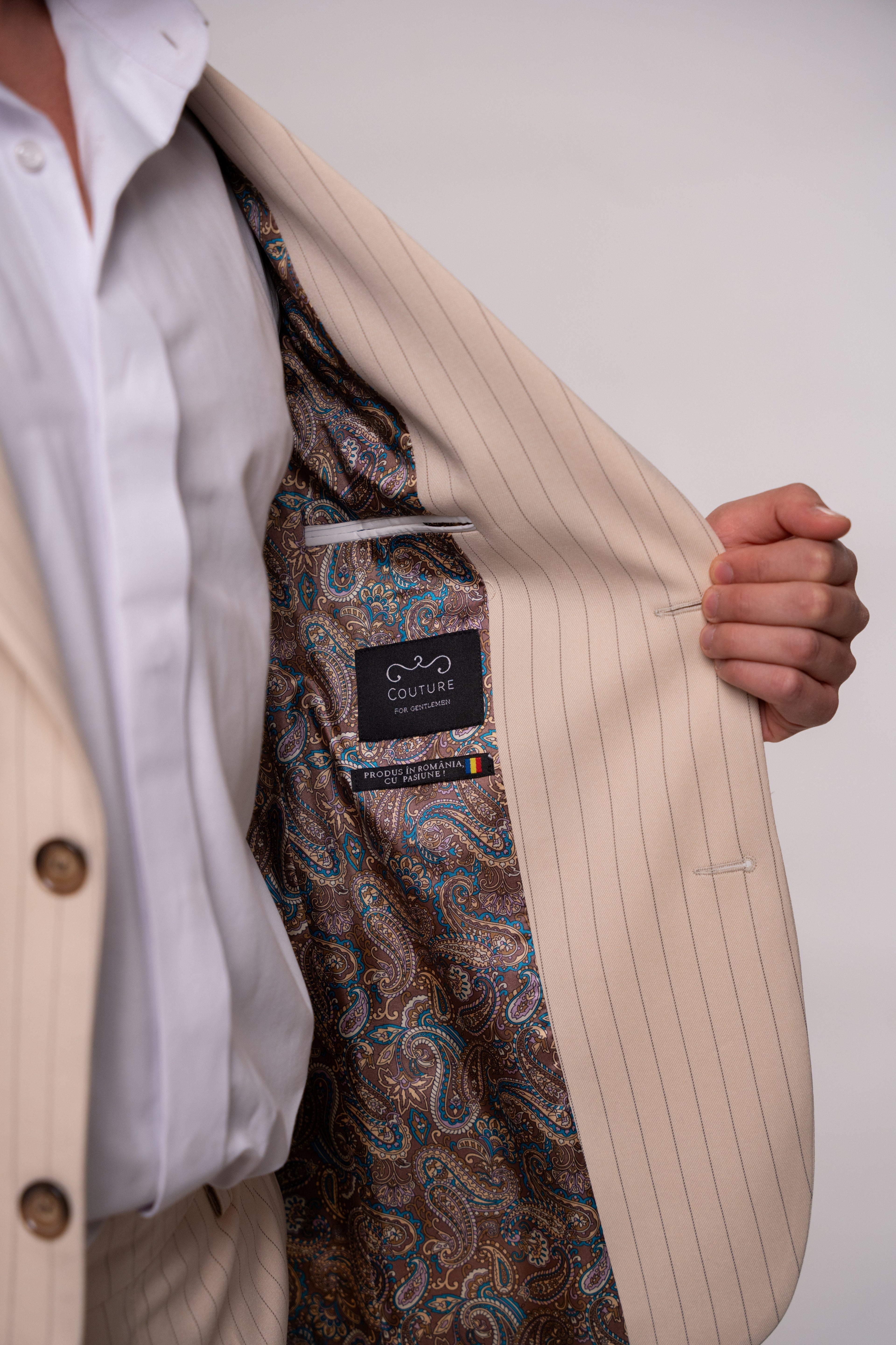 Beige men's striped suit jacket by CoutureforGentlemen, featuring classic pattern and tailored fit, shown on a mannequin.