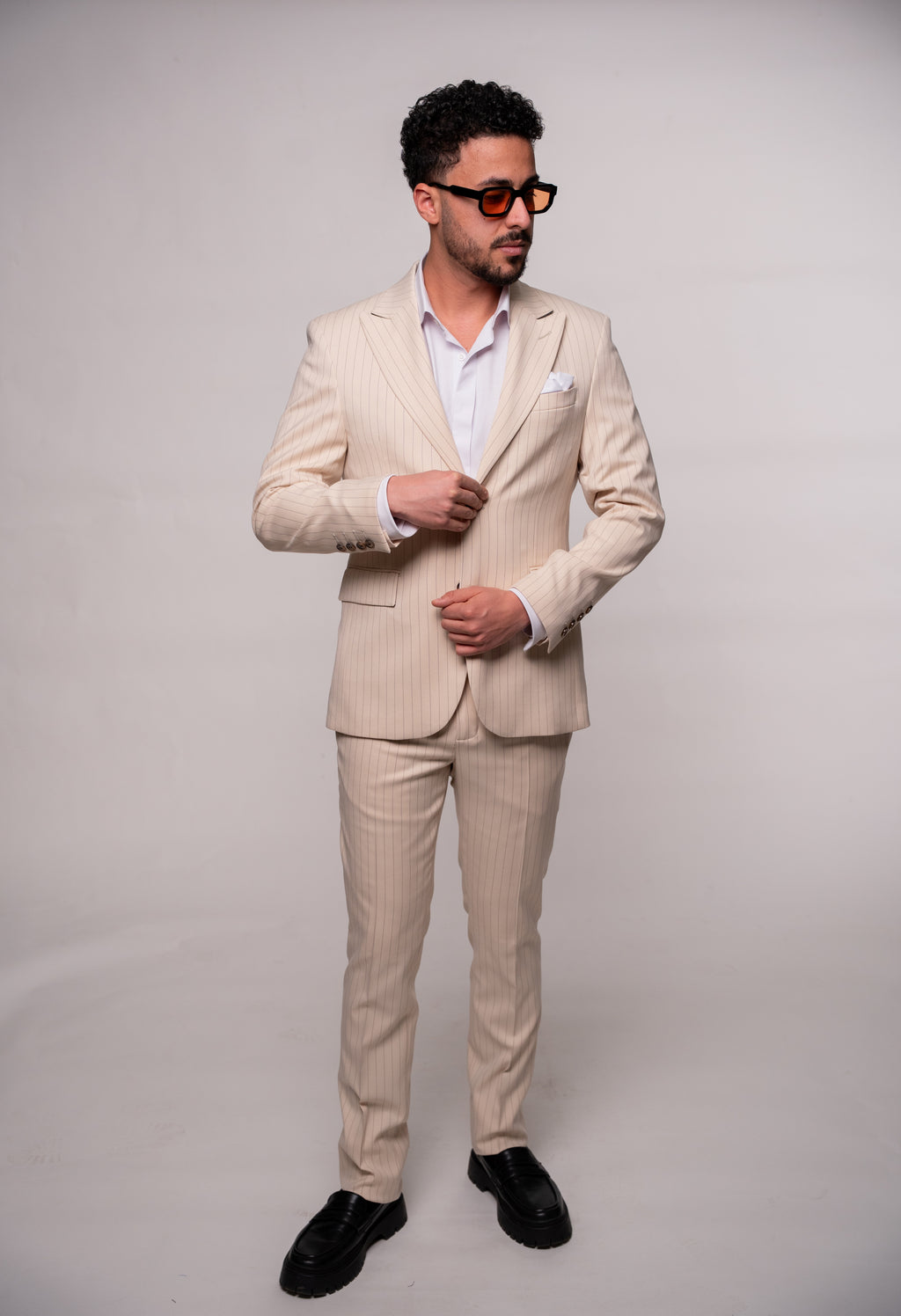 Beige men's striped suit jacket from CoutureforGentlemen, tailored fit with classic vertical stripe pattern.