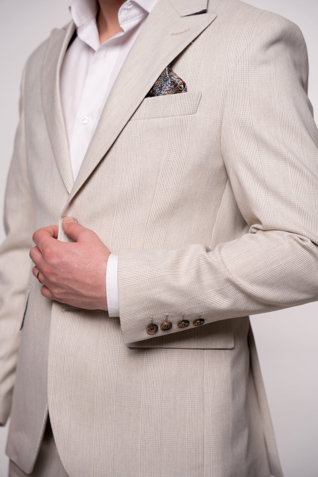 Light beige men's checked blazer with a classic collar and button details, ideal for stylish formal or casual wear.