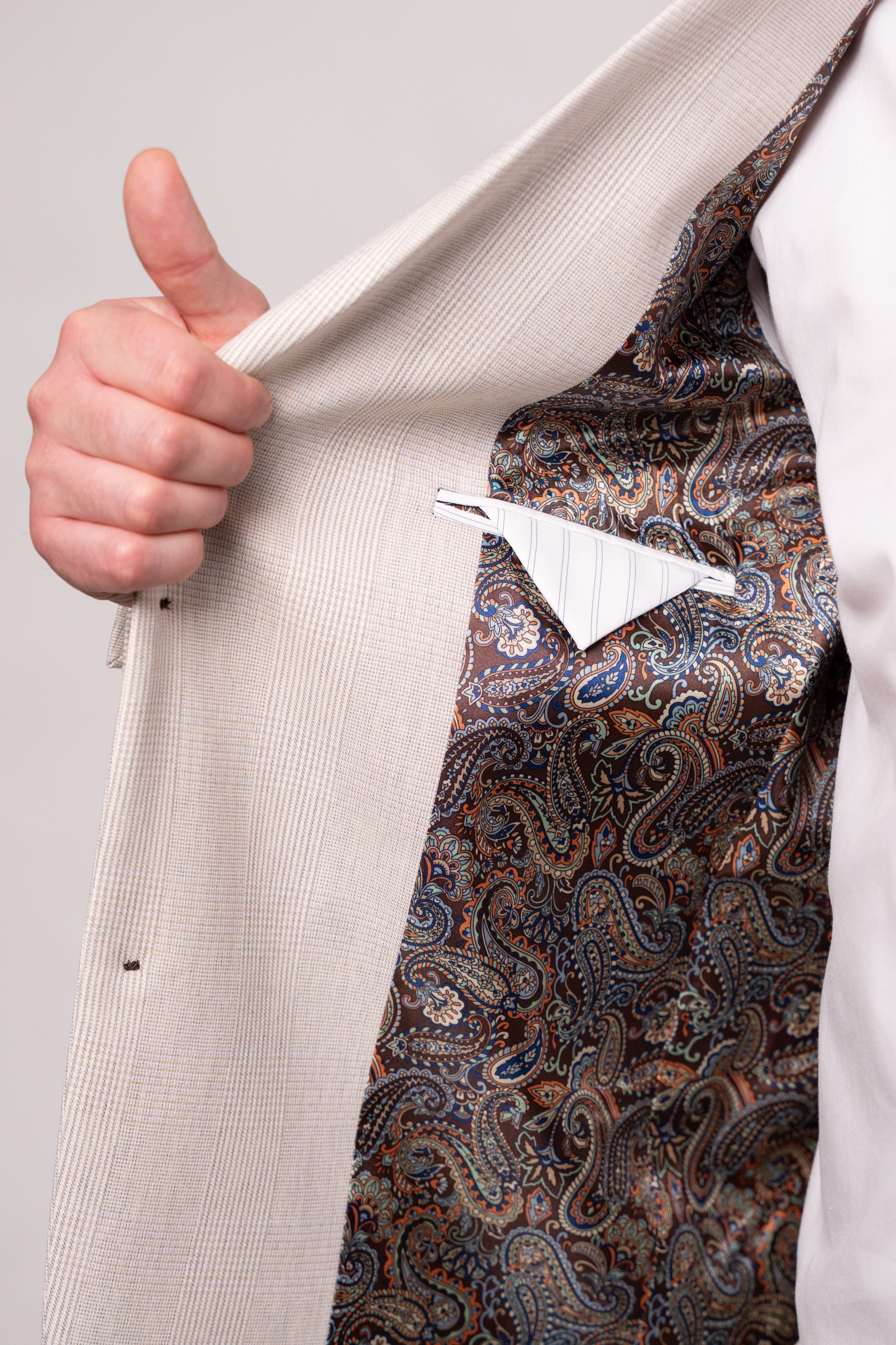 Light beige men's checked suit jacket from CoutureforGentlemen, featuring a classic plaid pattern and tailored fit.