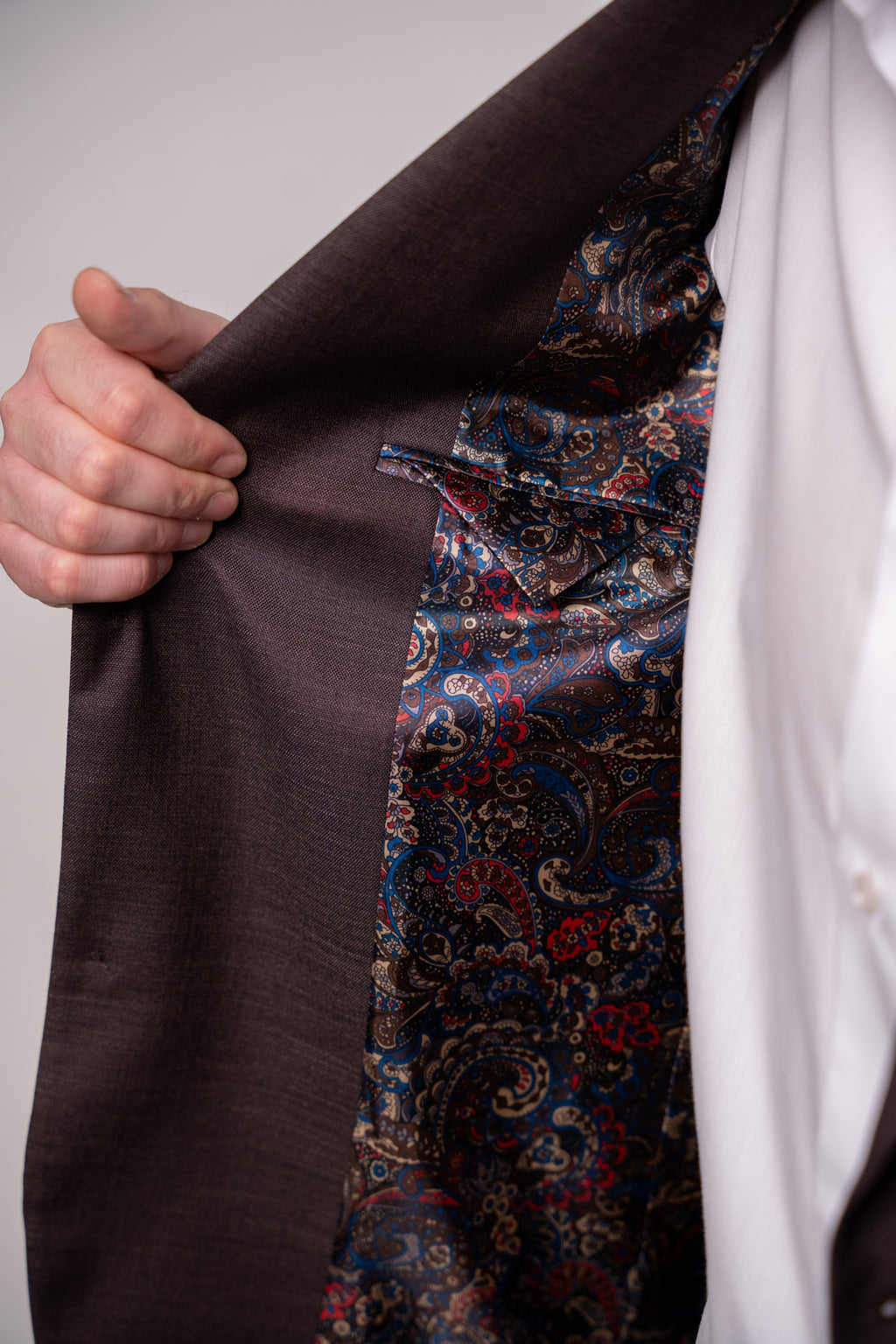 Chocolate brown Napoli costume for men, tailored fit, stylish design, shown from the front with detailed lapels and buttons.