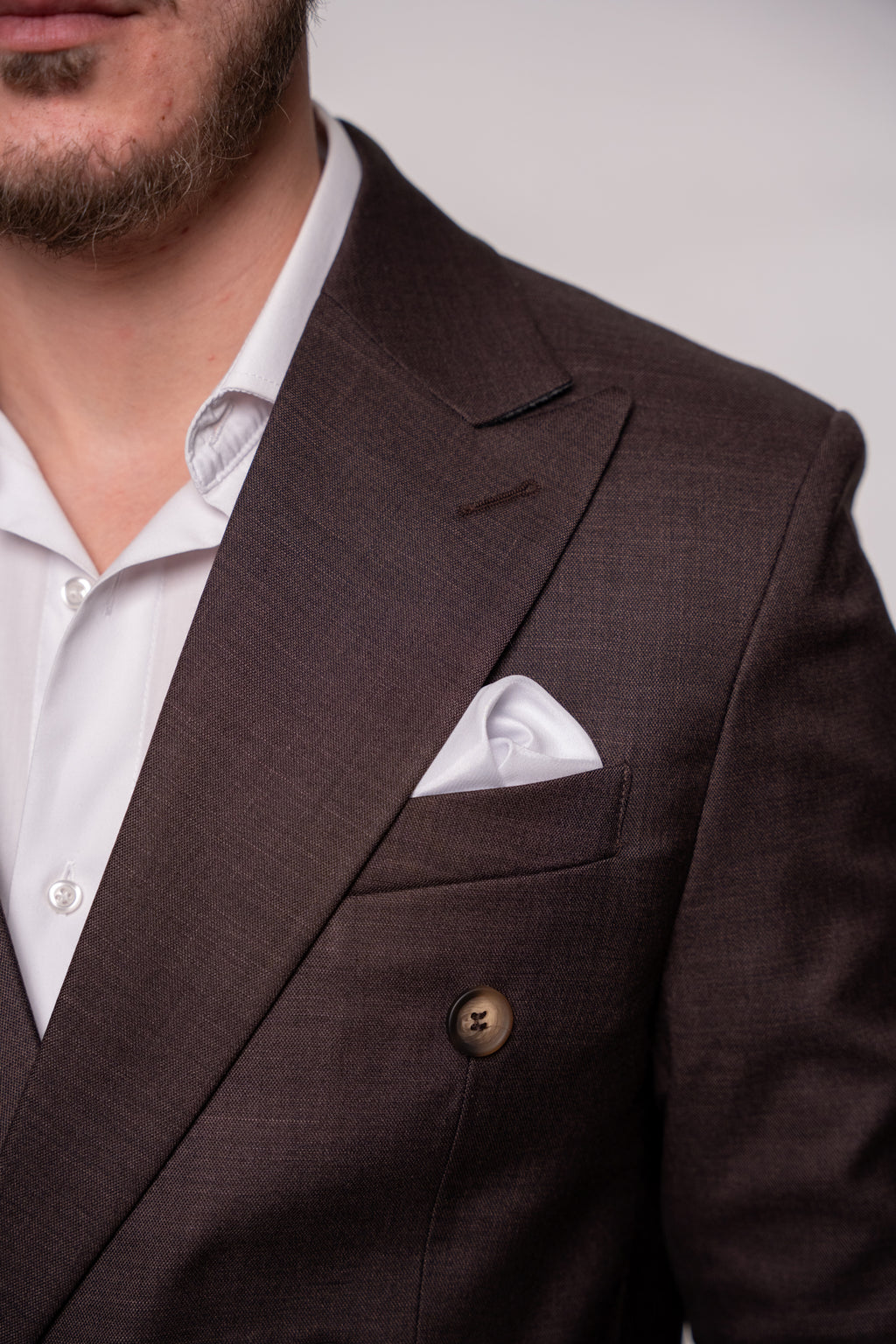 Chocolate brown Napoli two-row button suit jacket for men, featuring stylish buttons and tailored fit.