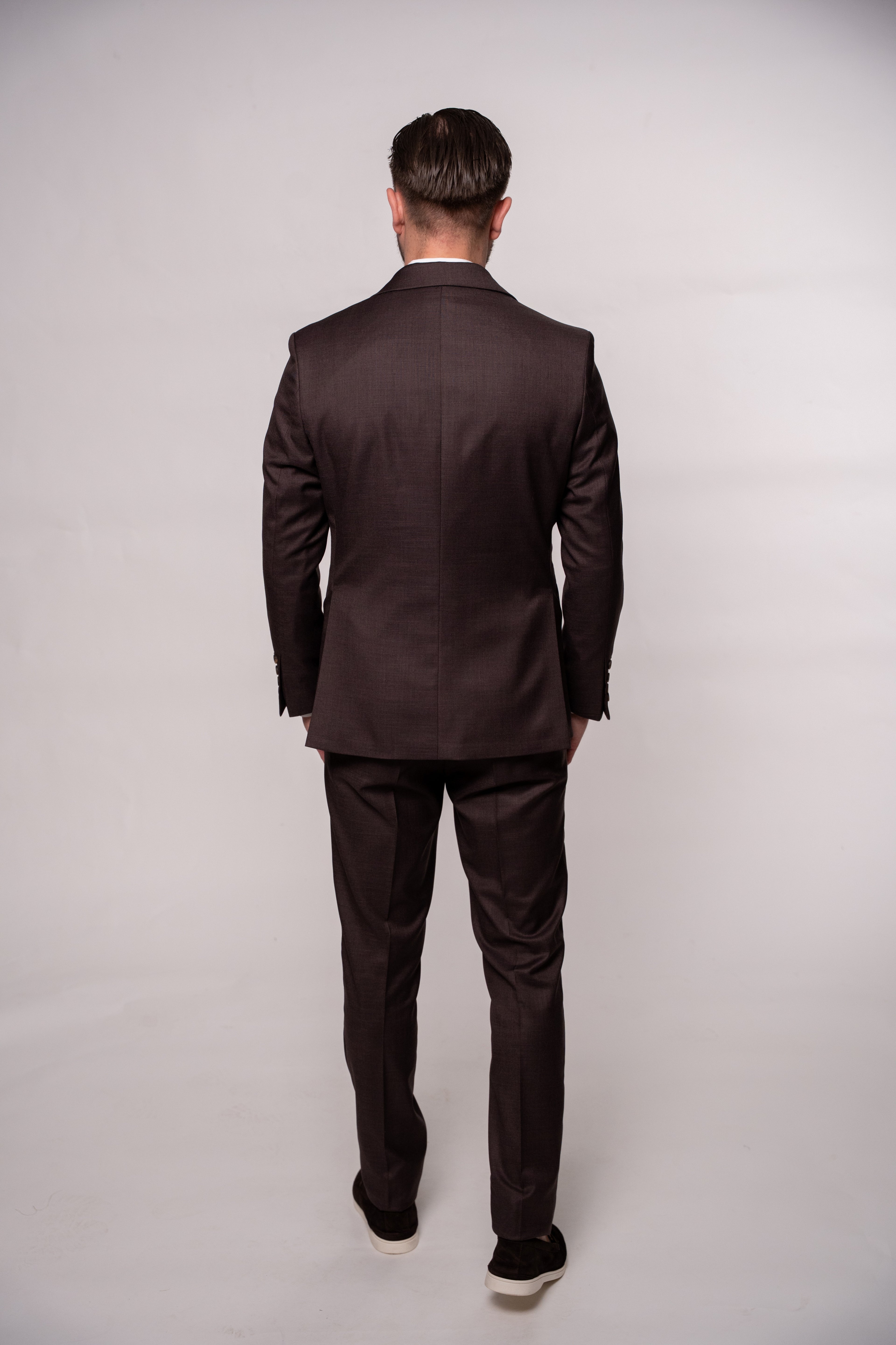 Chocolate brown Napoli two-row button suit for men, featuring detailed stitching and tailored fit, displayed on a mannequin.