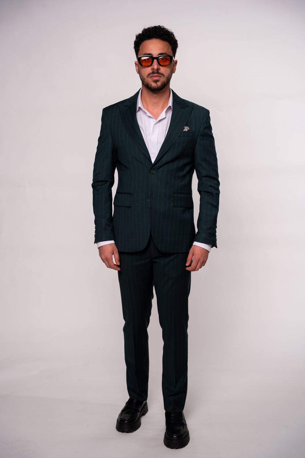 Men's green striped costume suit by CoutureforGentlemen, tailored fit with classic pinstripes, shown on a mannequin.