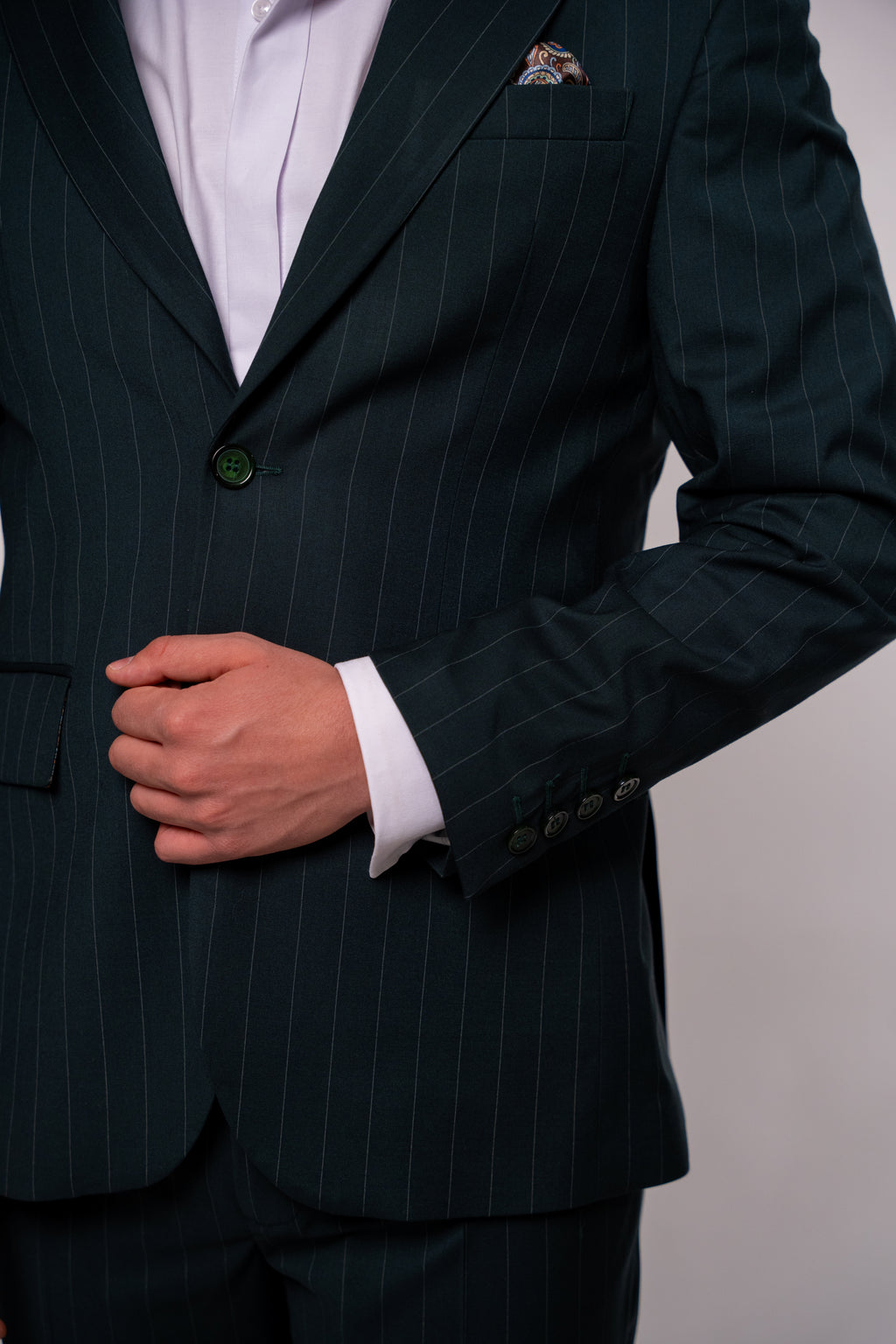 Green men's striped suit jacket featuring tailored fit and stylish design, ideal for formal or business occasions.
