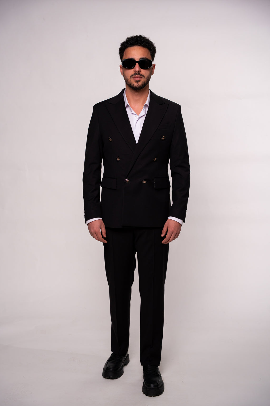 Black men's costume jacket with two rows of buttons, tailored fit, stylish formal wear by CoutureforGentlemen.