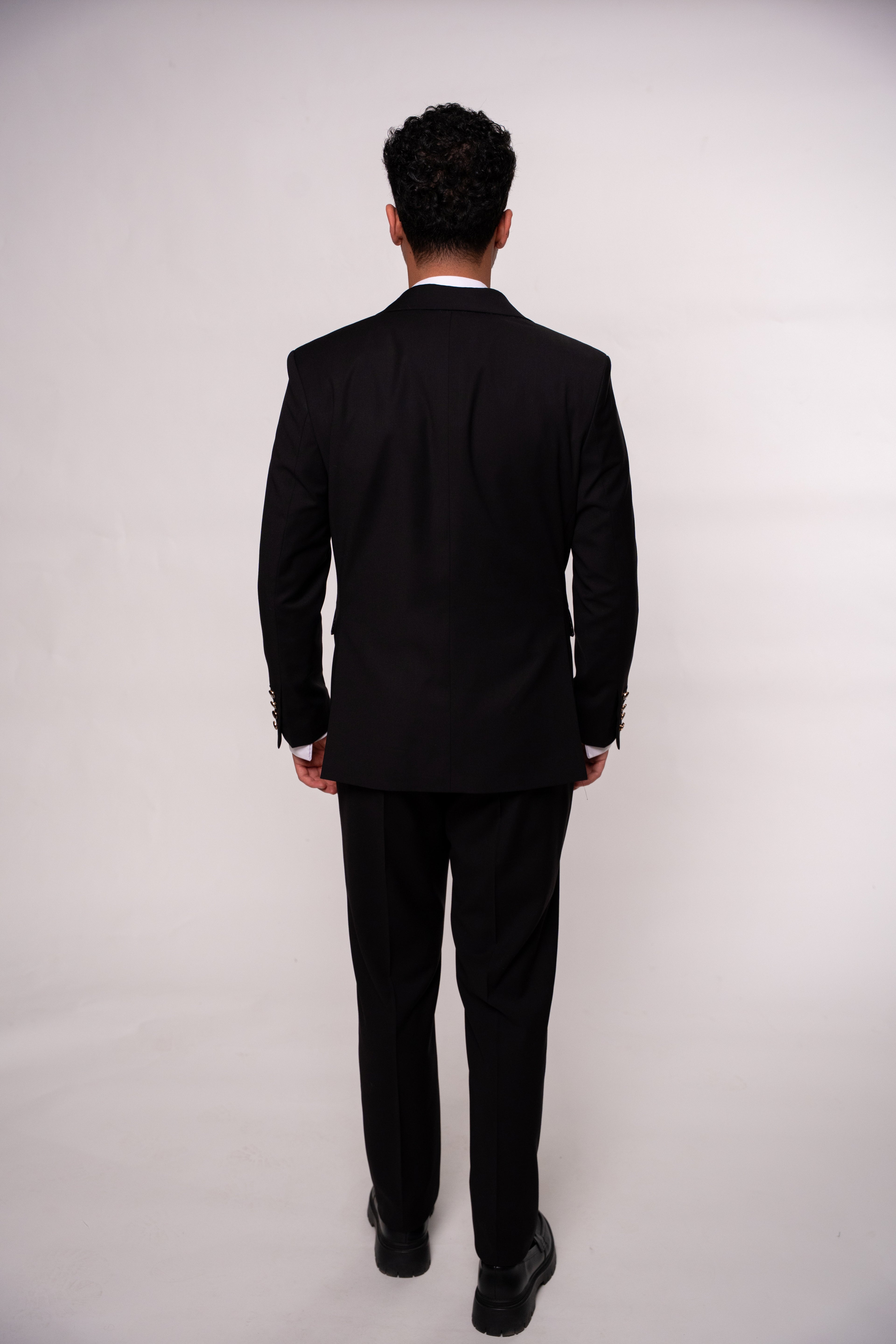 Black men's costume jacket with two rows of buttons, stylish formal wear by CoutureForGentlemen, shown in image DSC5626.jpg.