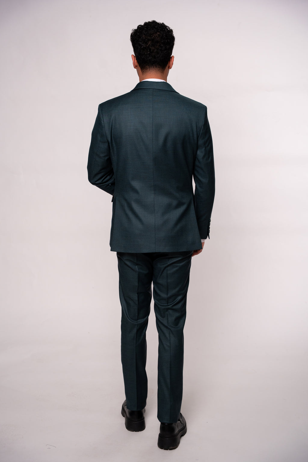 Dark green men's blazer with two rows of buttons, tailored fit, stylish design, from Couture for Gentlemen.