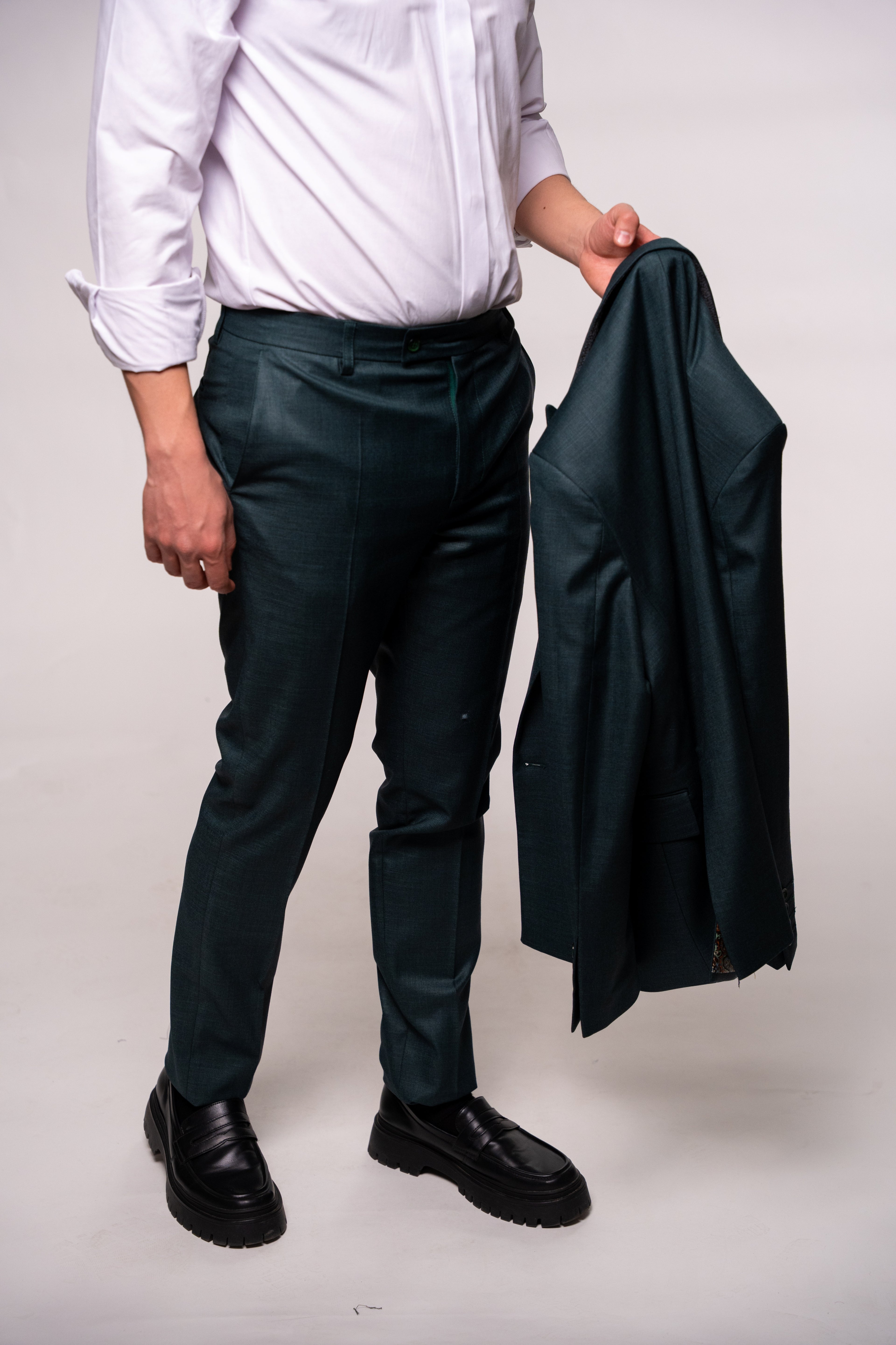Dark green men's double-breasted blazer with two rows of buttons, stylish and tailored by CoutureForGentlemen.