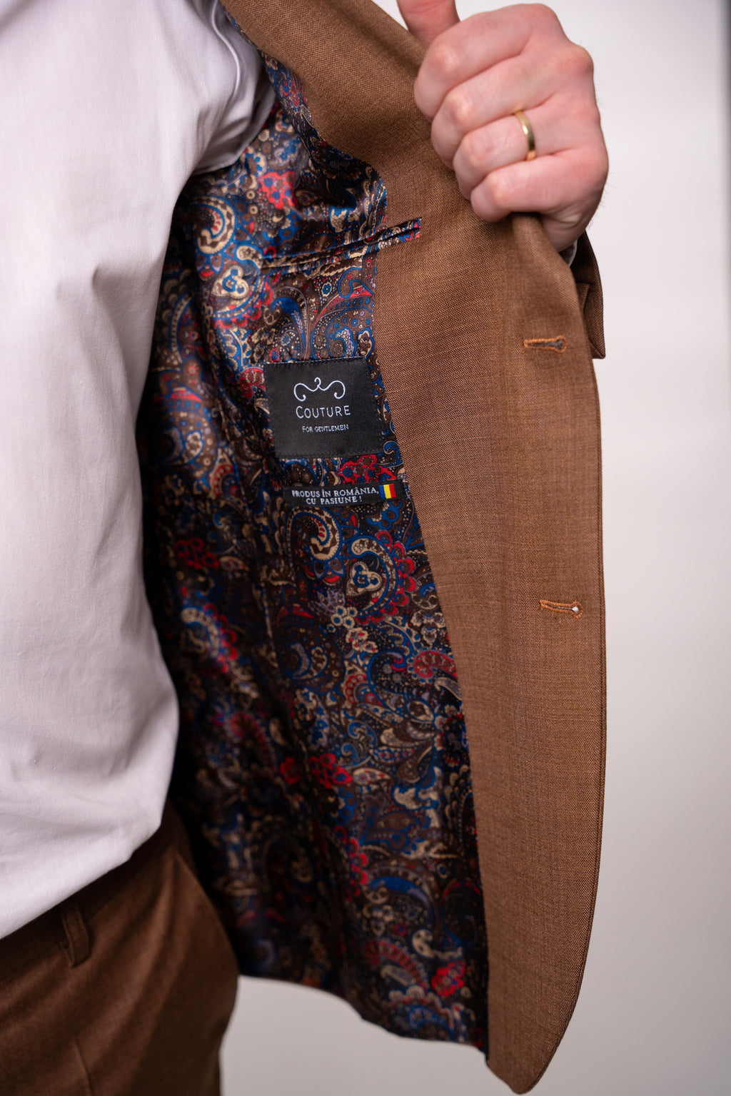 Light brown men's suit by Nisa, featuring tailored fit and classic style, displayed on a hanger.