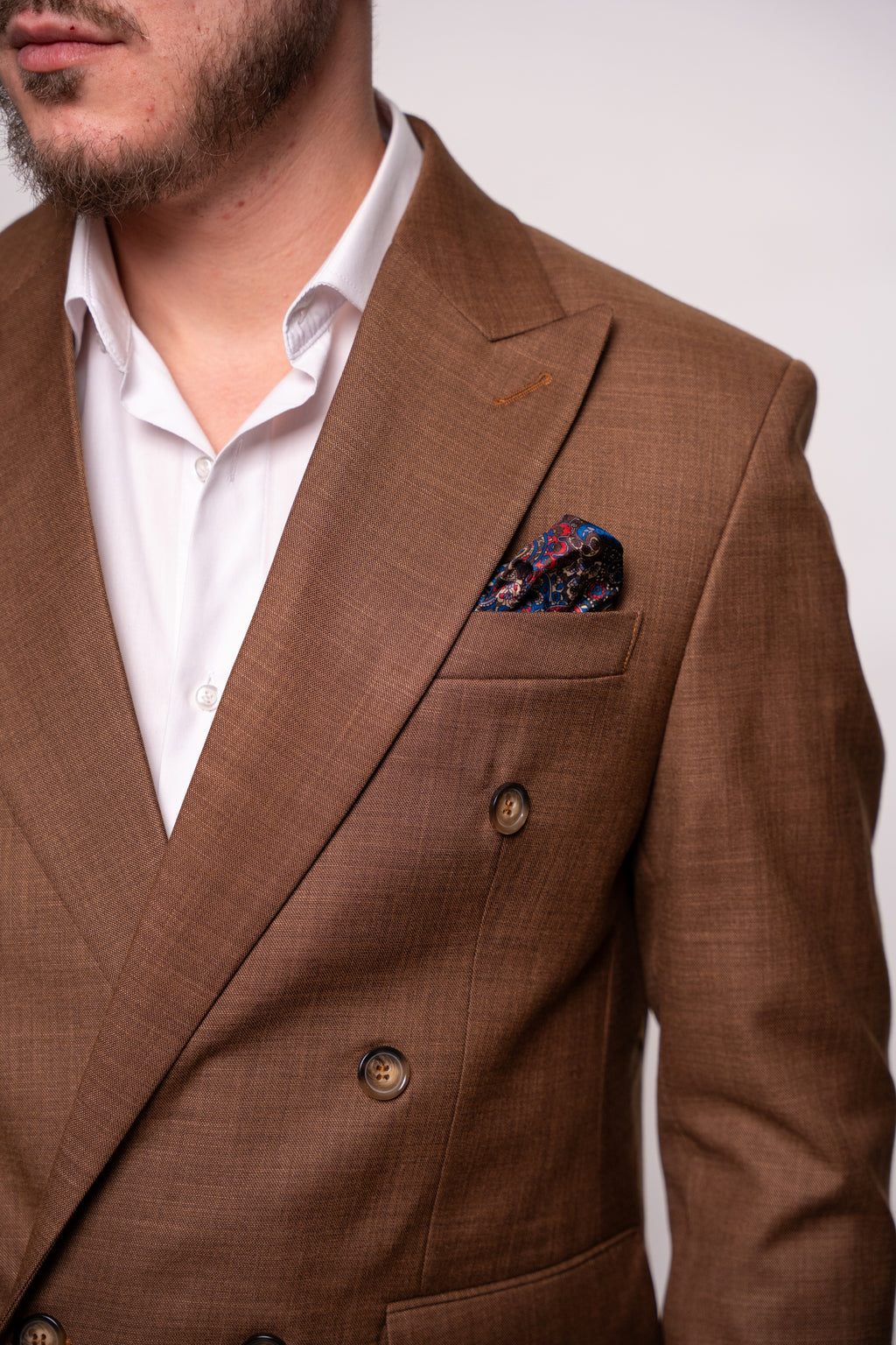 Men's brown two-row button costume jacket with a classic design, featuring prominent buttons, from Couture for Gentlemen.