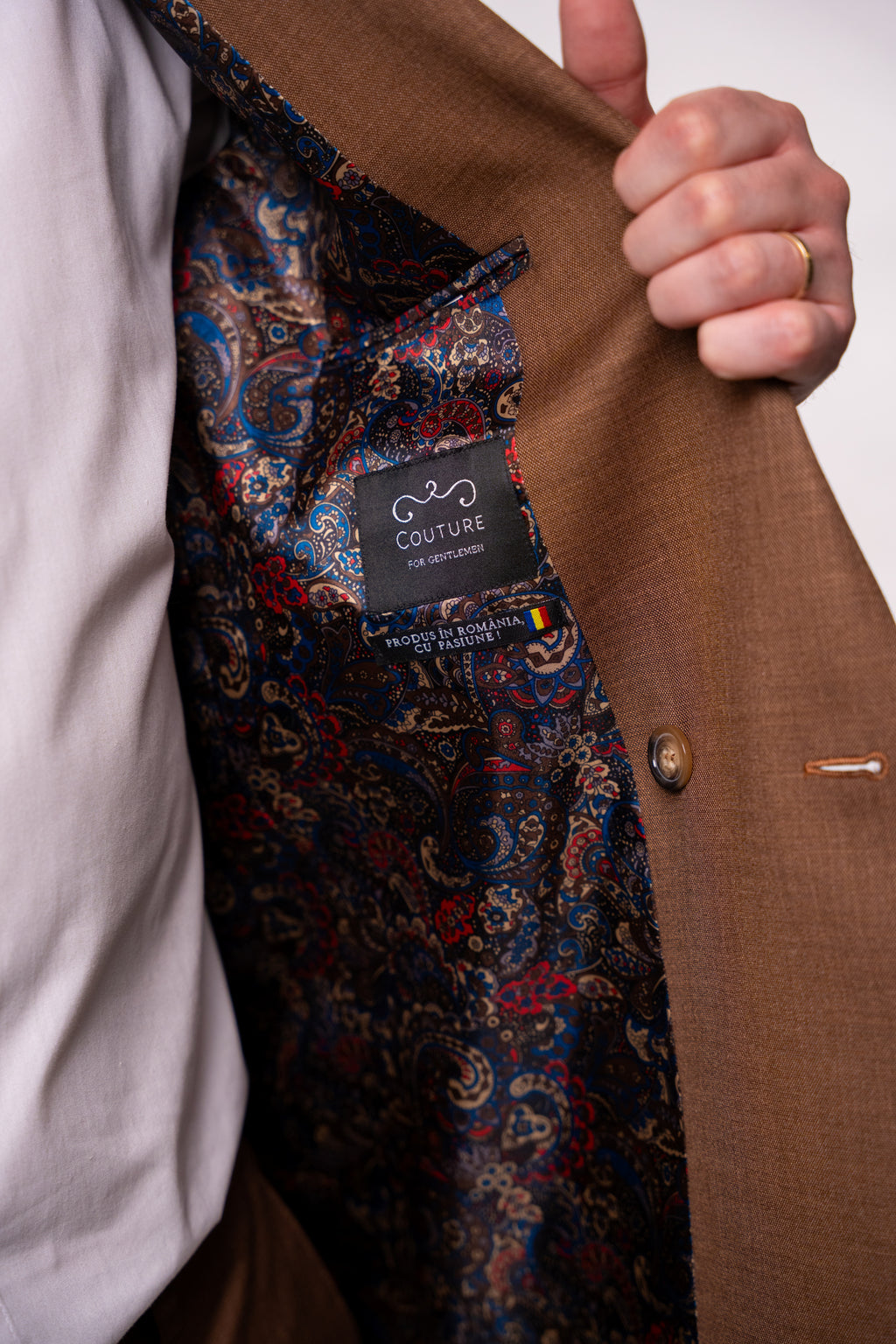 Brown men's double-breasted blazer with two rows of buttons, stylish and tailored by CoutureforGentlemen.