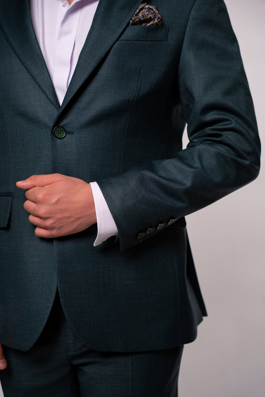 Dark green men's costume blazer from CoutureforGentlemen, tailored fit with lapels and button closure, stylish formal attire.