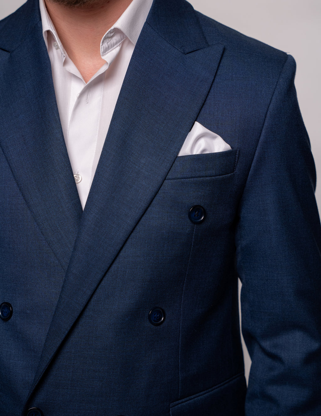 Men's navy textured double-breasted blazer with two rows of buttons, stylish and tailored by CoutureforGentlemen.