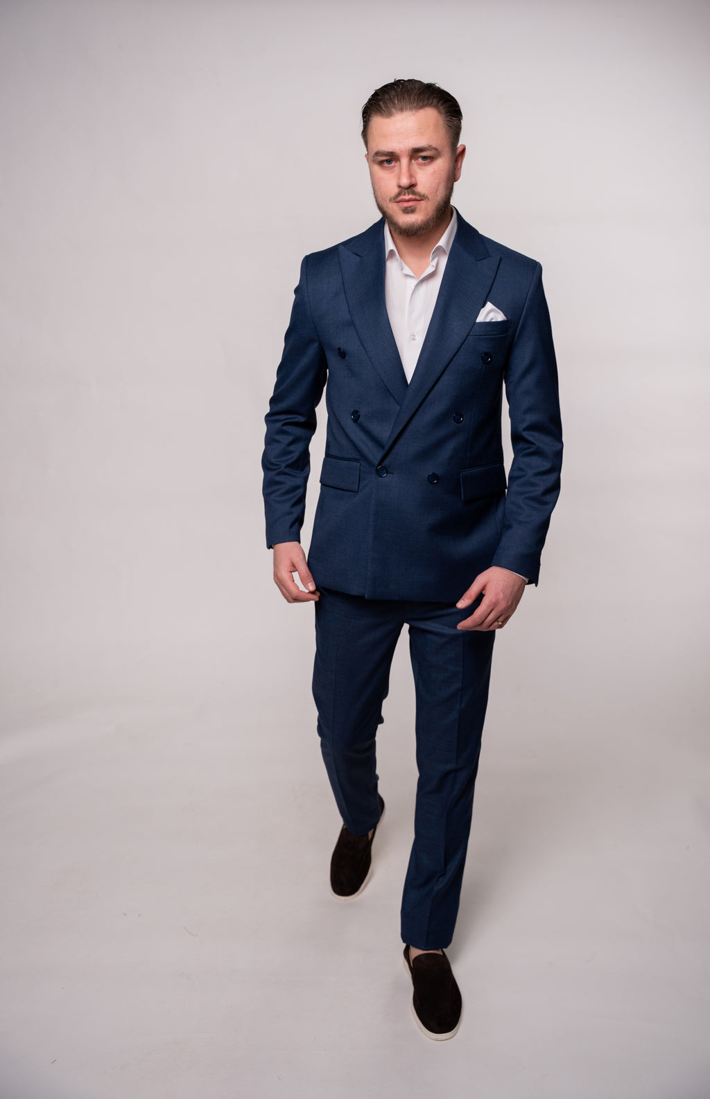 Men's navy blue textured blazer with two rows of buttons, stylish formal jacket by CoutureforGentlemen, front view.