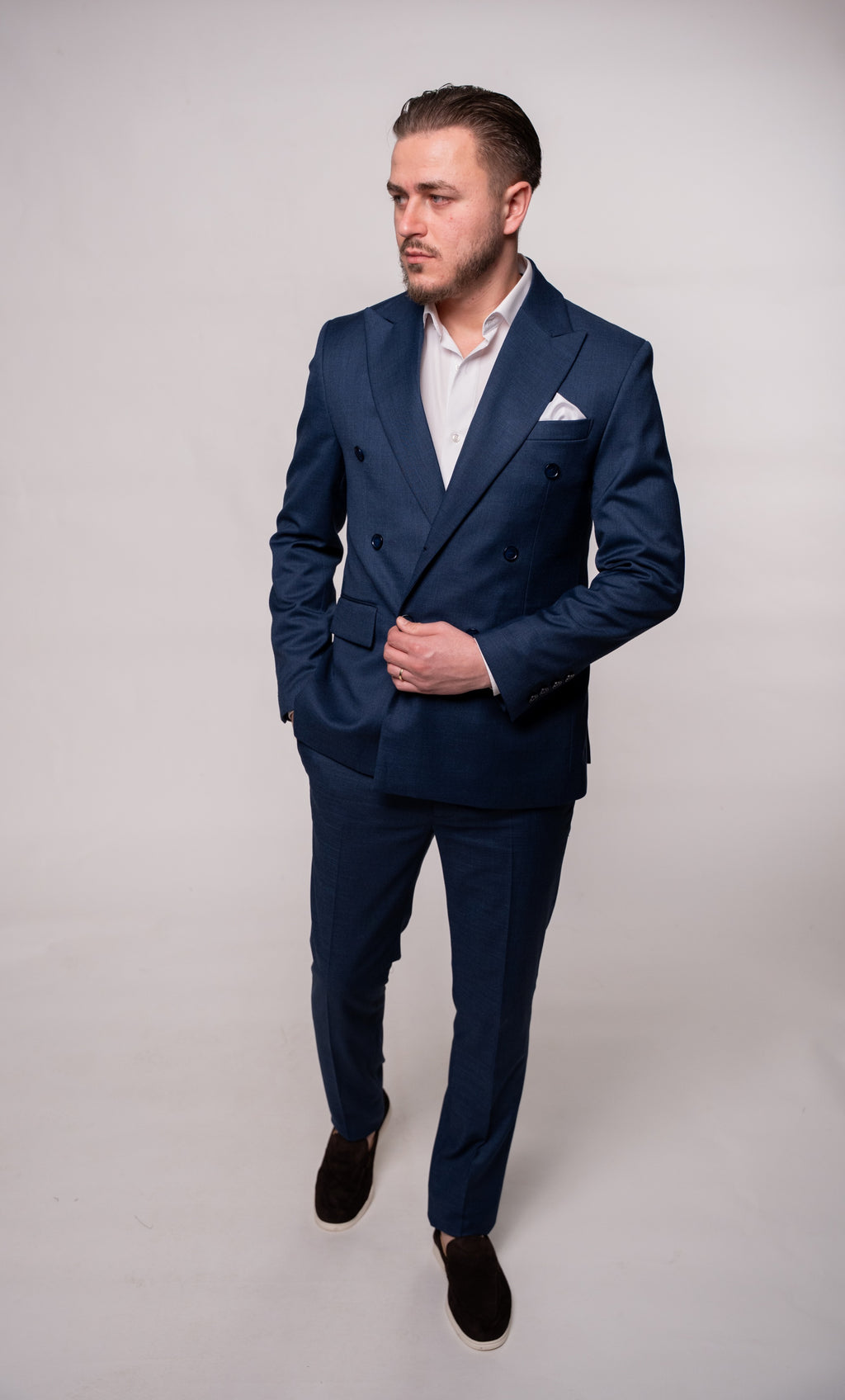 Men's navy textured blazer with two rows of buttons, tailored fit, stylish formal jacket for sophisticated attire.