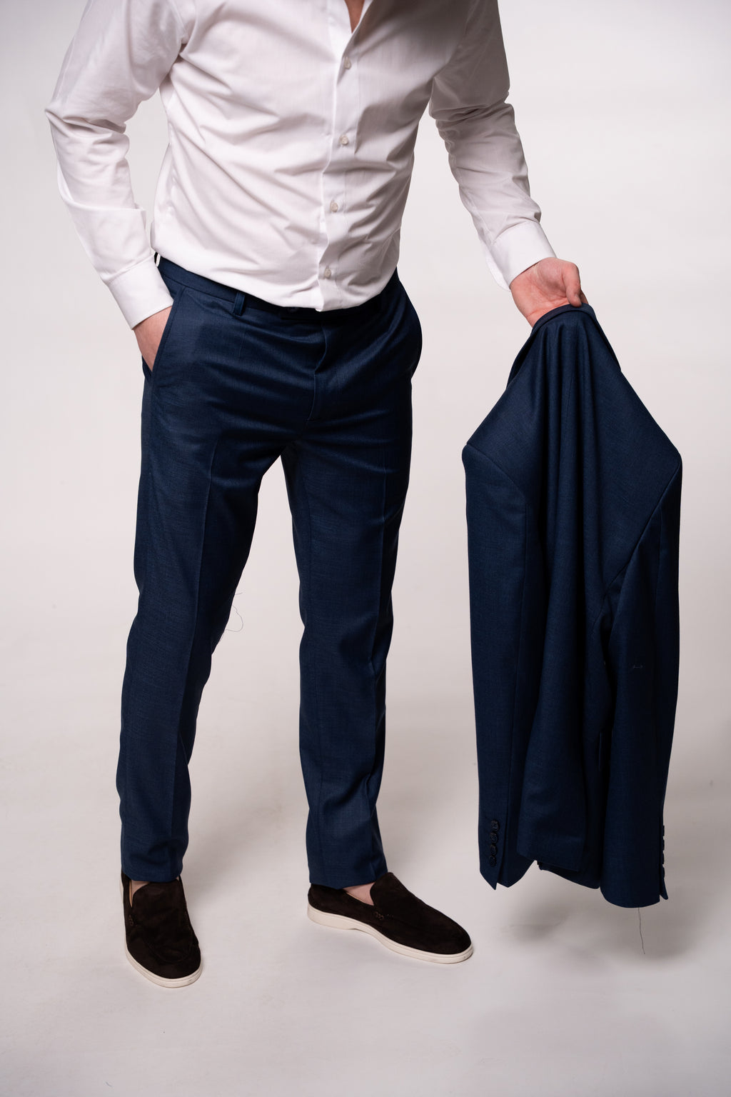 Men's navy textured two-button blazer with double lapel from CoutureforGentlemen, shown on a model.