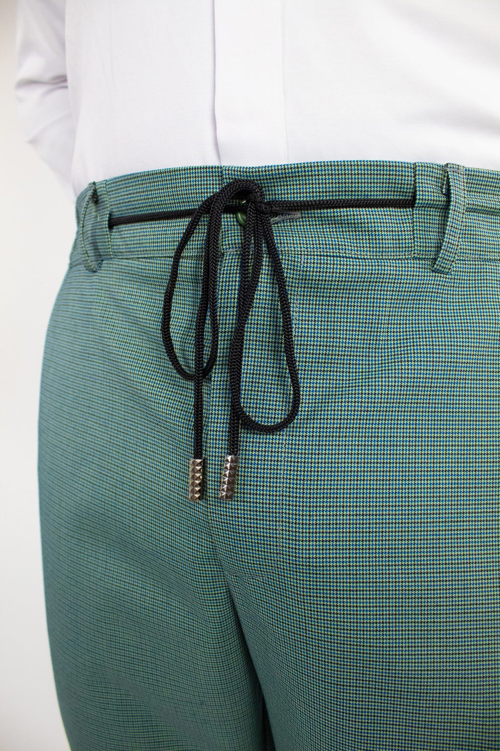 Green chino pants by Couture for Gentlemen, stylish men's casual trousers with a tailored fit.