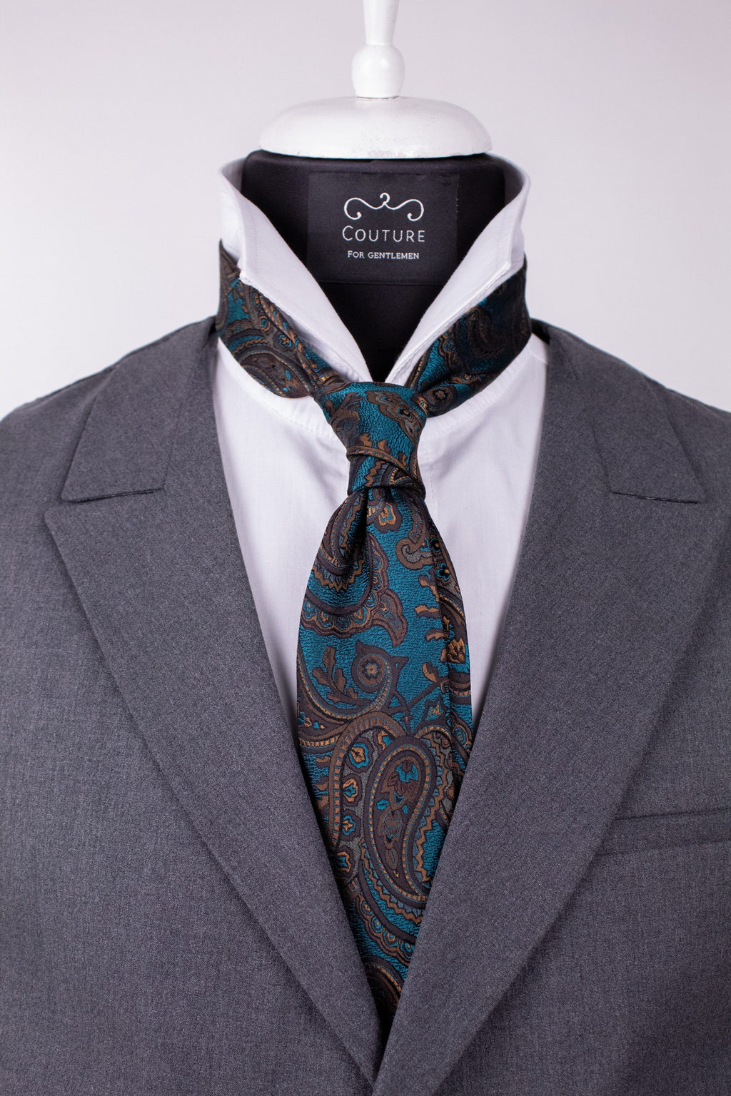 Maroon and turquoise silk cravat with a classic pattern, stylish accessory for men's formal attire.