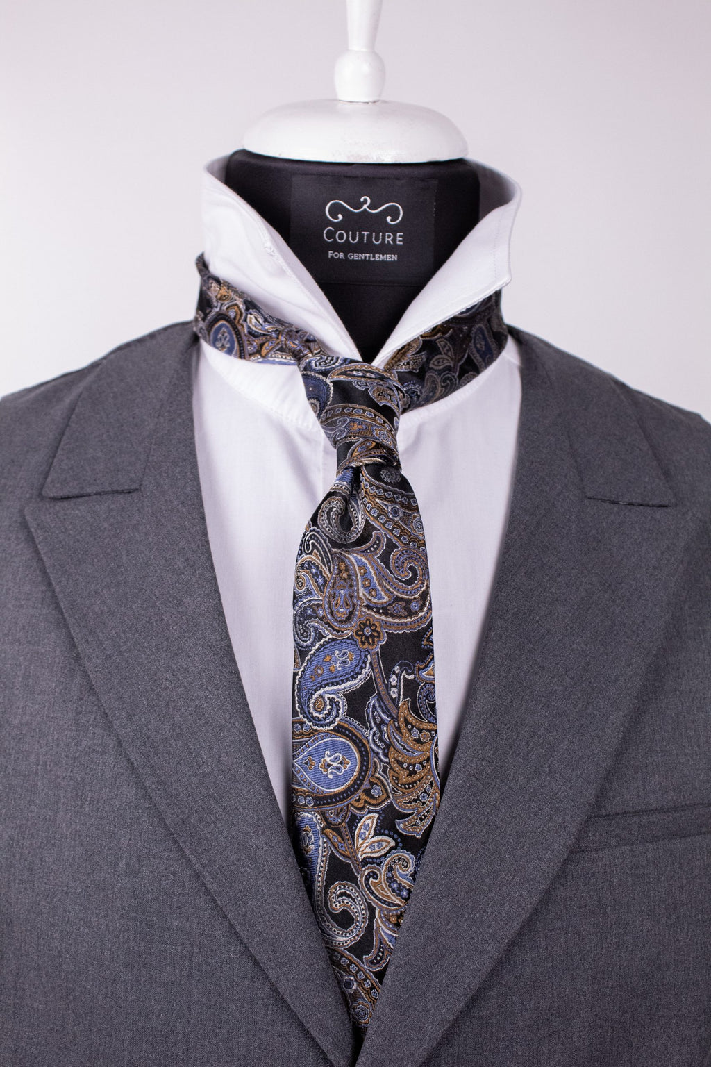 Black silk tie with a smooth texture, stylish accessory from Couture for Gentlemen, shown on a neutral background.