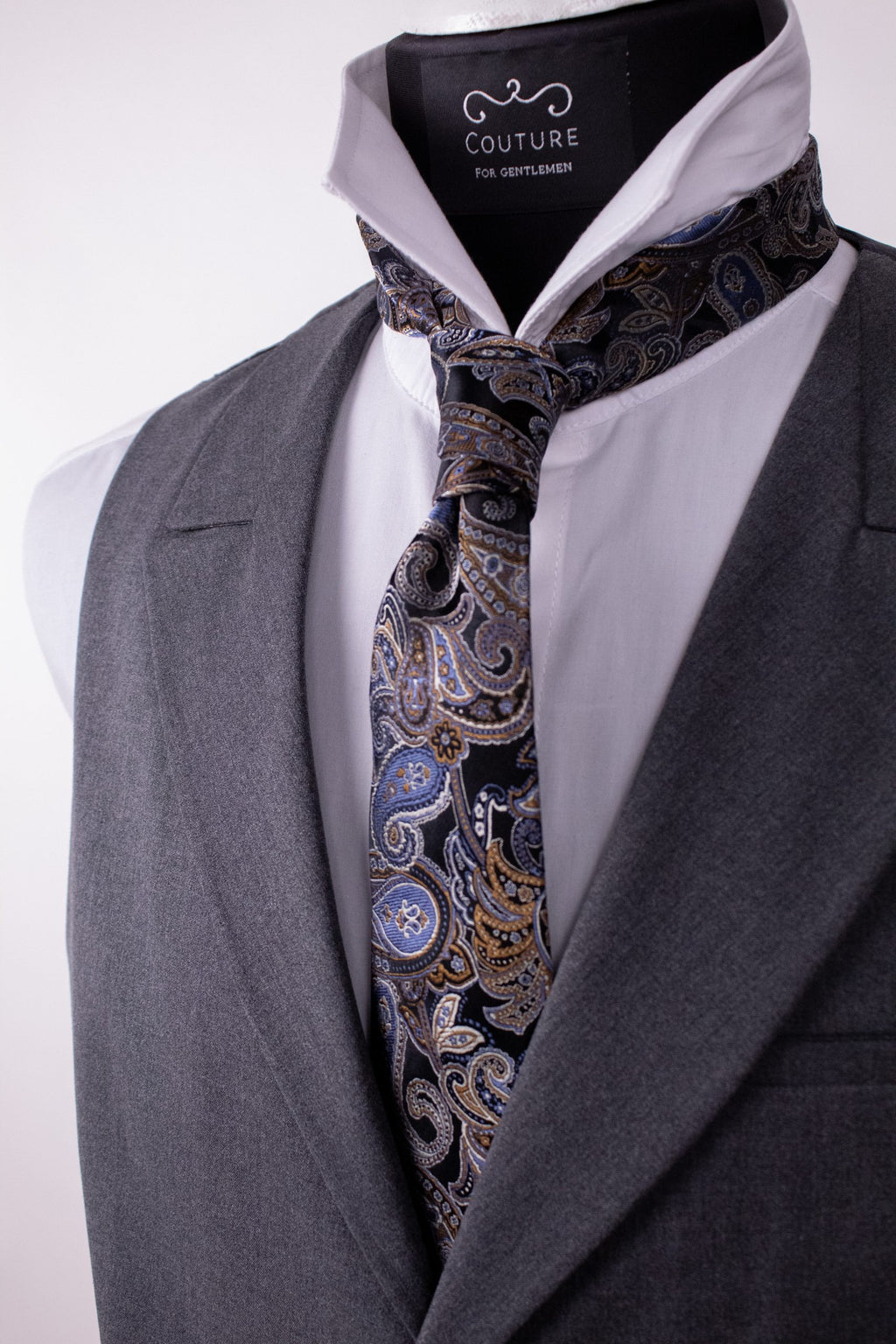 Black silk tie with subtle pattern, crafted from natural silk, ideal for formal men's fashion.