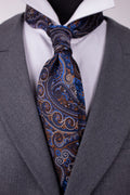 Blue floral silk cravat featuring intricate floral patterns, perfect for elegant men's fashion.