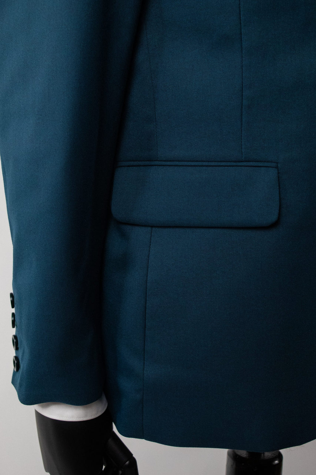 Emerald green Santorini costume by Couture for Gentlemen, featuring elegant fabric and tailored design.